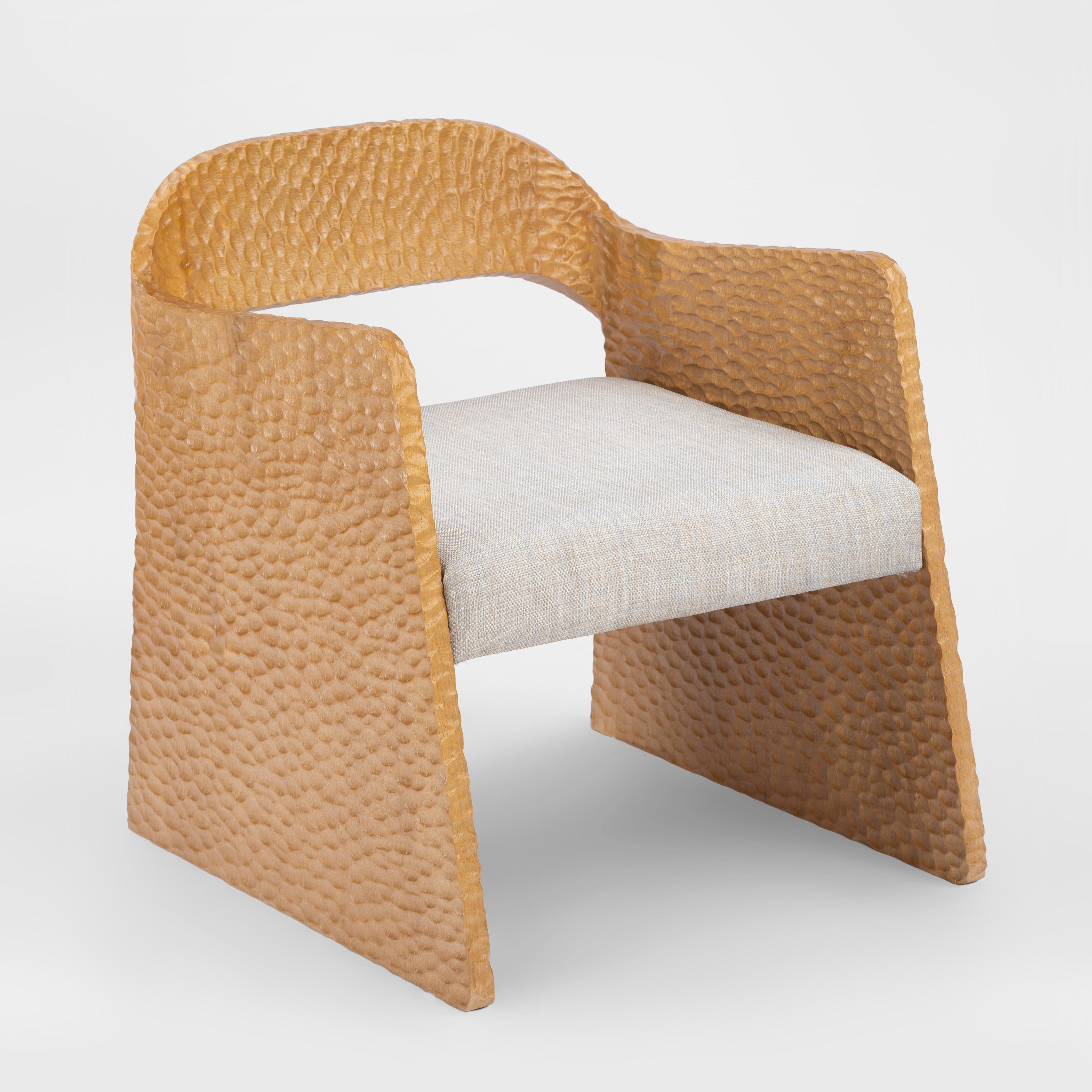 Hand-carve massive oak wood armchair inspired by Ancient Egyptian Temples.

The temple armchair is regarded as the spiritual Godfather of the Nubia Collection. This regal chair is hand carved from massive Oak, so each one is unique. The chair