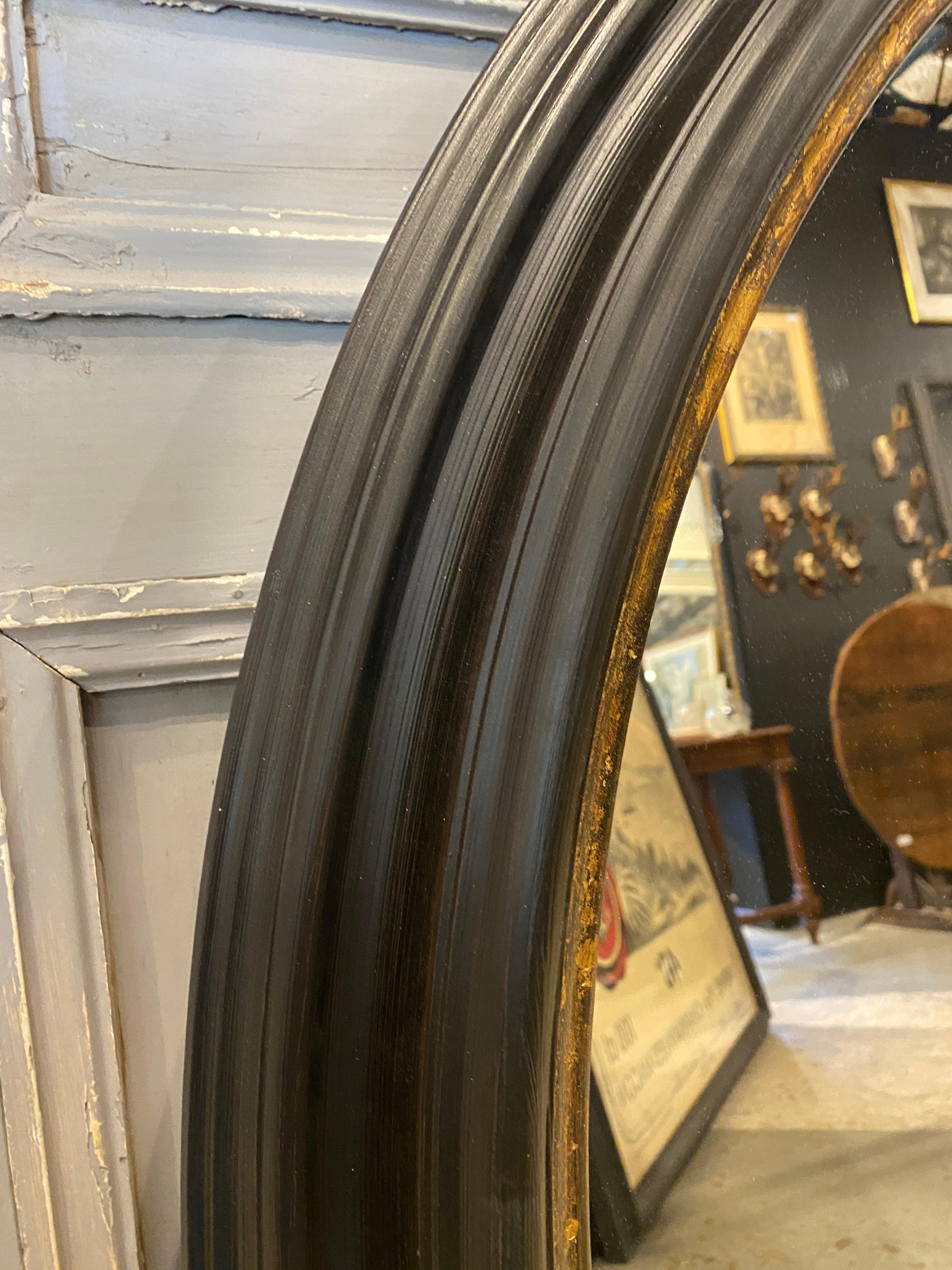 French Hand Carved Matte Black and Bronze Gilt Round Mayson Mirror