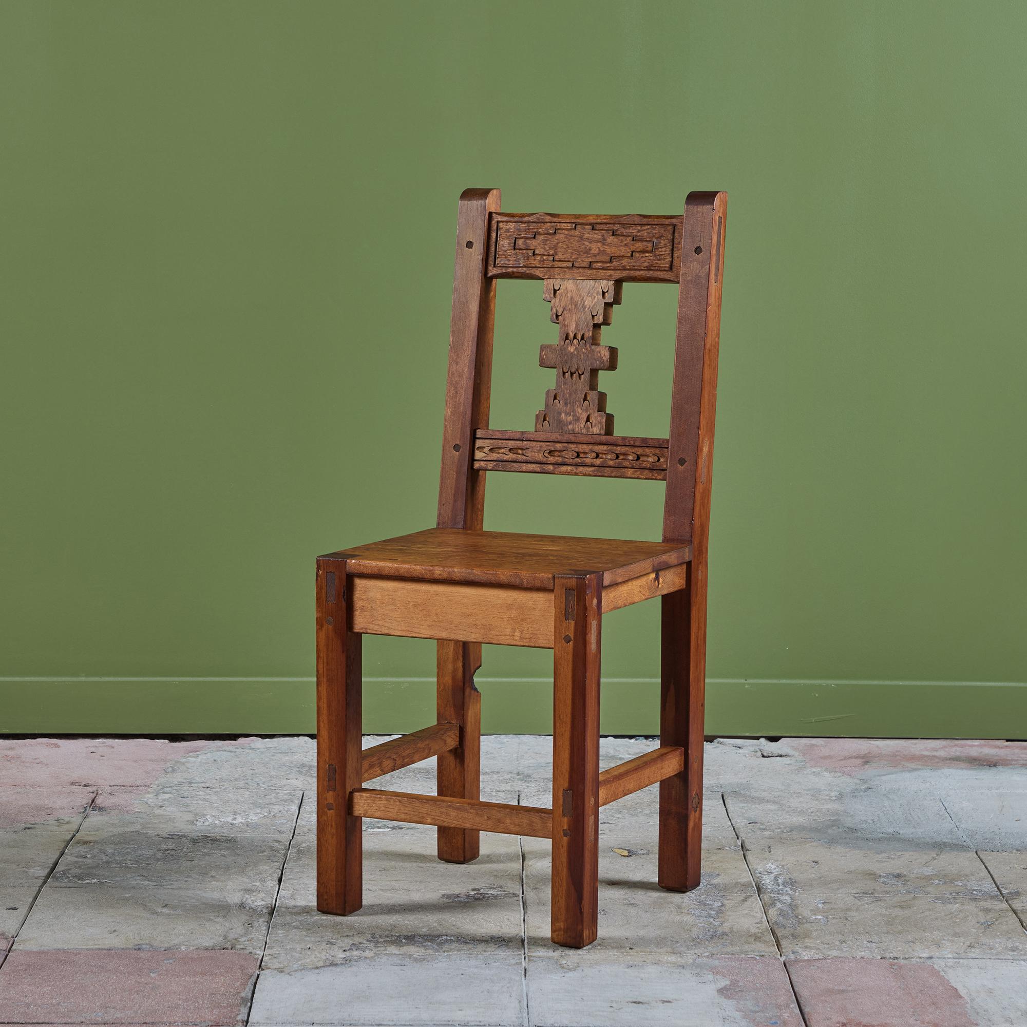 Hand carved Mexican modern side chair. The chair features a mahogany frame with a carved detailing along the front of the backrest. Perfect as an accent chair, desk chair or a set of dining chairs! We have five, please inquire about making a unique