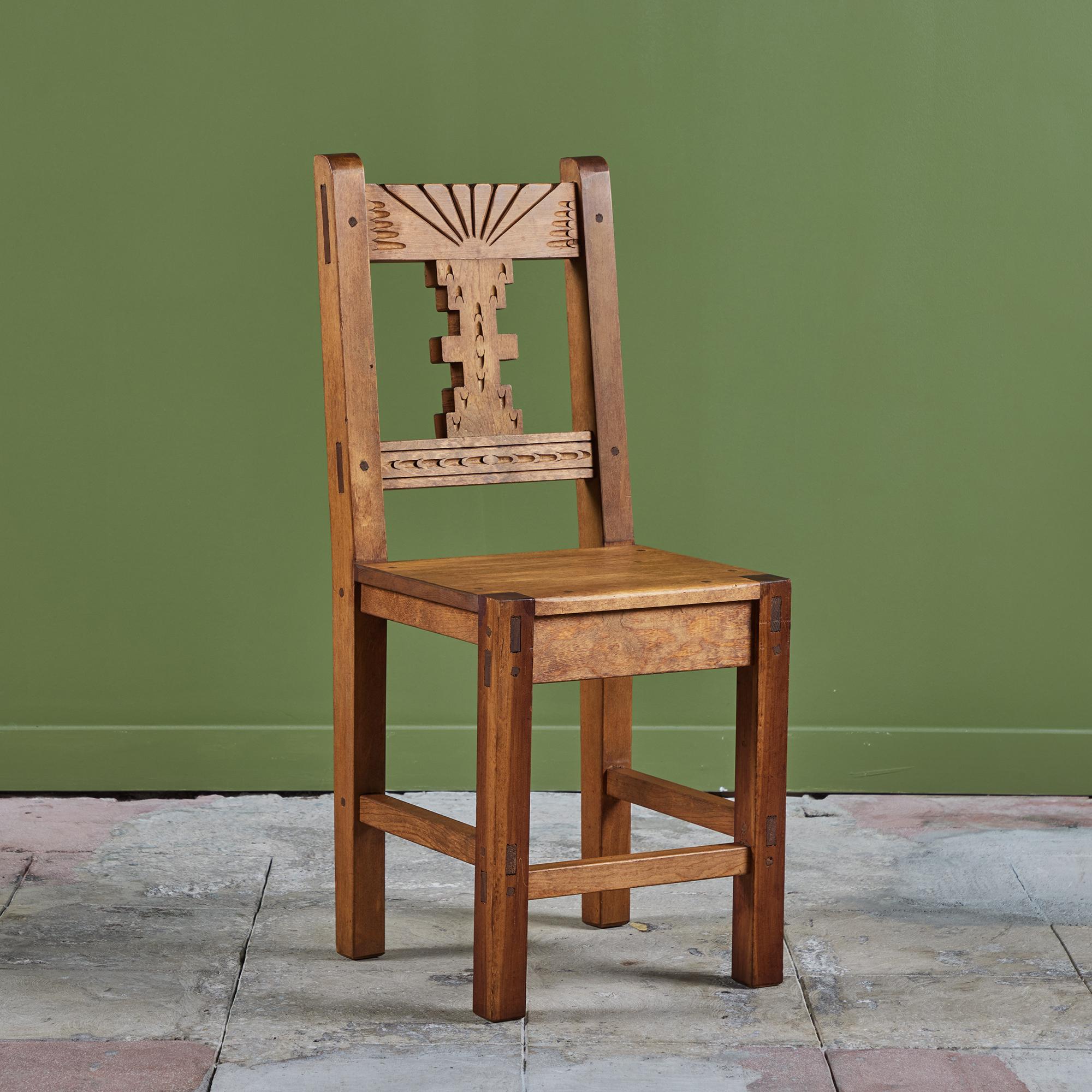 Hand carved Mexican modern side chair. The chair features a mahogany frame with a carved detailing along the front of the backrest. Perfect as an accent chair, desk chair or a set of dining chairs! We have five, please inquire about making a unique