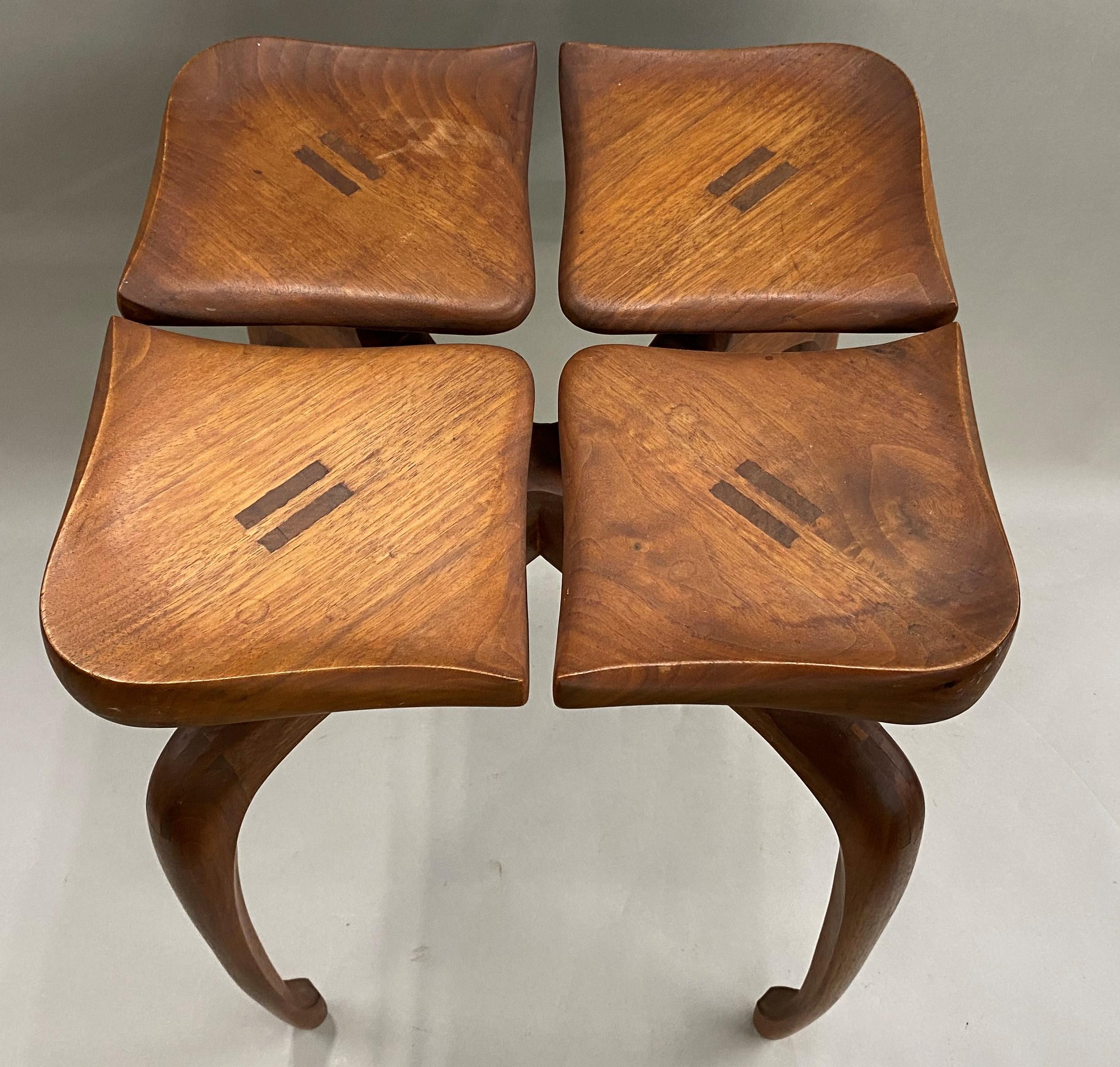 An interesting hand carved modernist low table with four separated petals, each on their own stem, forming a square top, with curled edges on the leaves, supported by four shaped legs. The maker carved their initials on the underside “BN 72”. Very