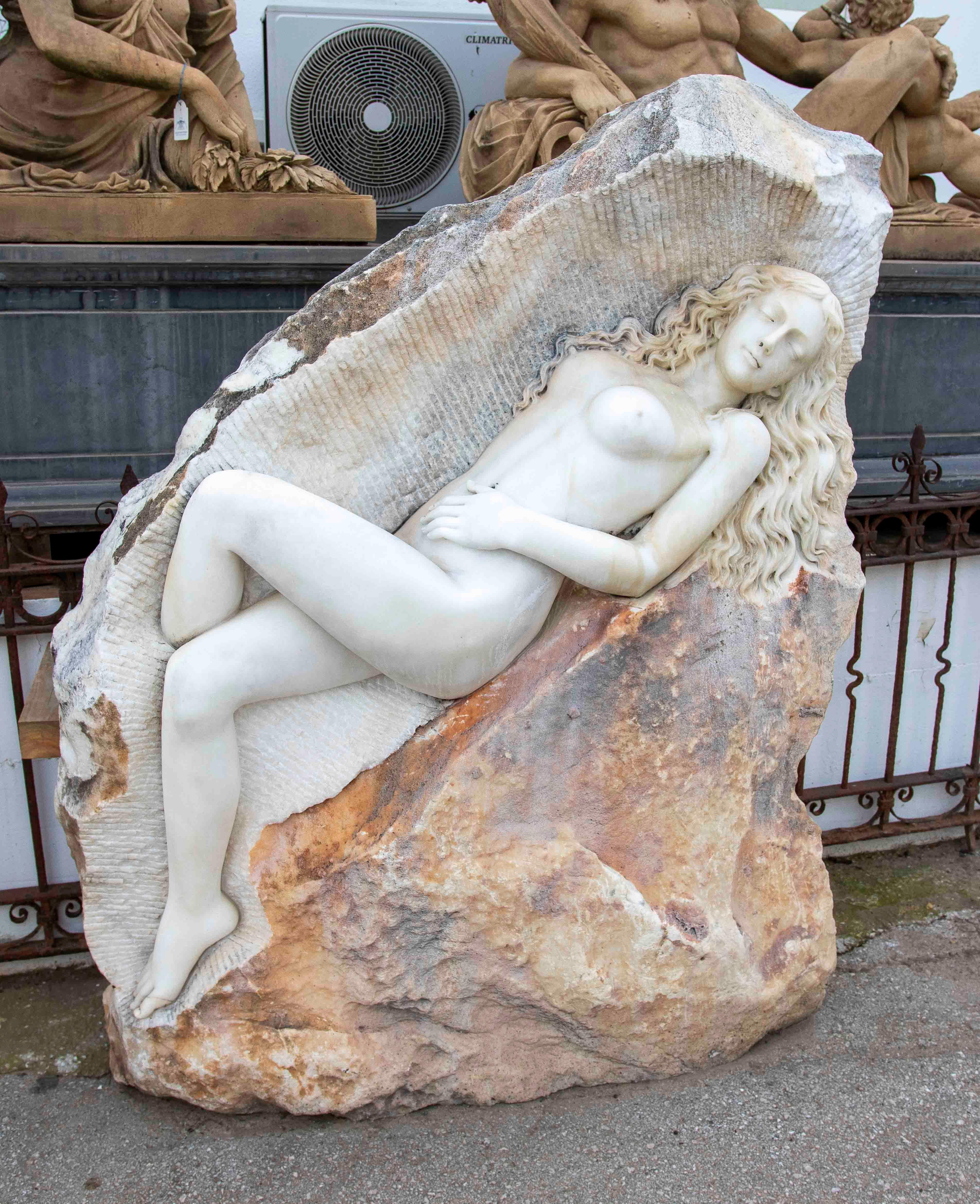 Hand-Carved Hand Carved Monumental Sculpture of a Woman on Marble Rock. For Sale