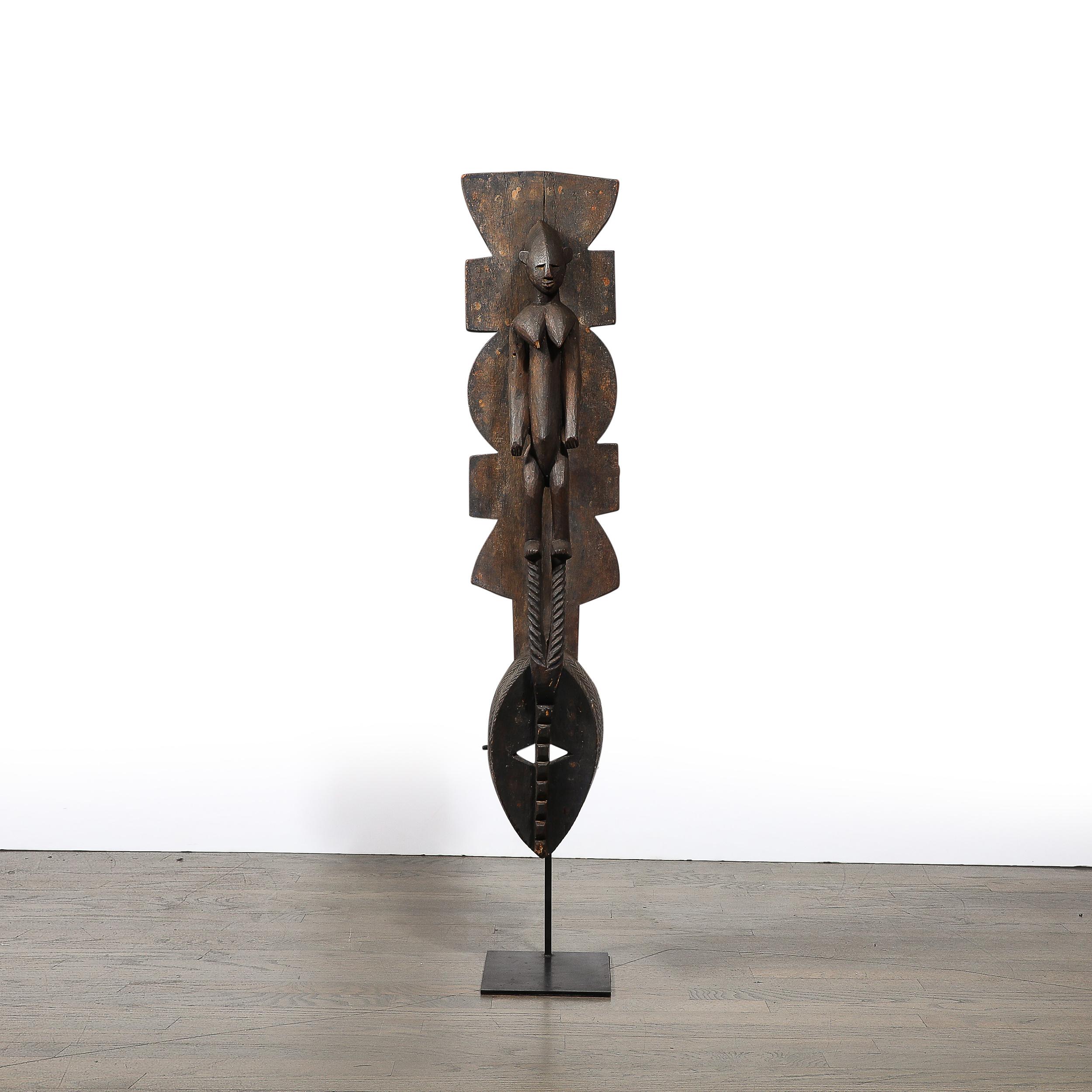 This strikingly bold and well detailed Hand-Carved Mossi Tribe Ceremonial Wood Mask on Elevated Sculptural Base originates from Burkina Faso, Circa 1960. The Mossi people from which this mask originates are the largest ethnic group of Burkina Faso,