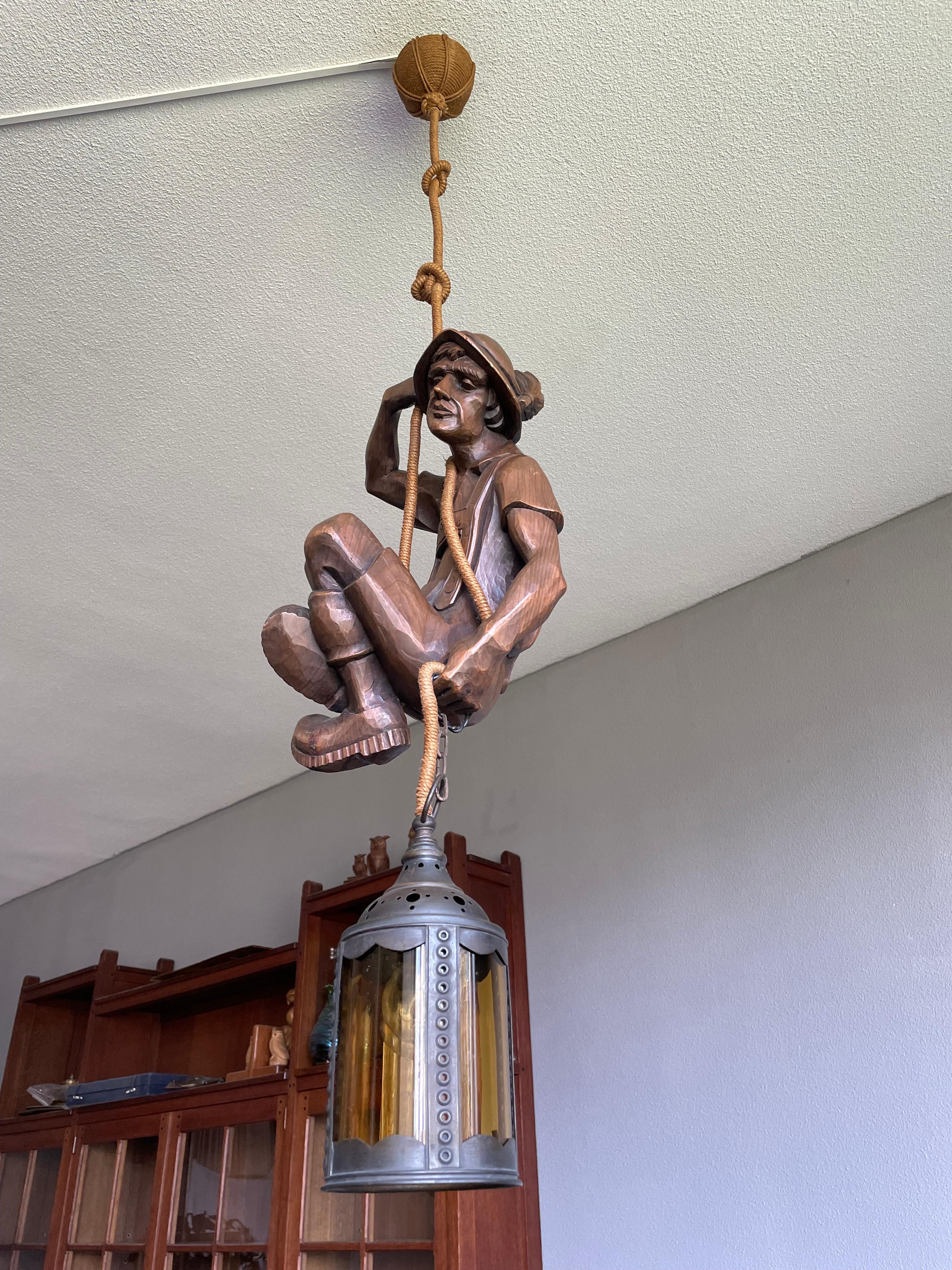 Rare and beautifully crafted light fixture for Black Forest and mountaineering enthousiasts.

This beautifully hand carved and sculptural light fixture is in superb condition. A light like this will look great at home, but it can also create the