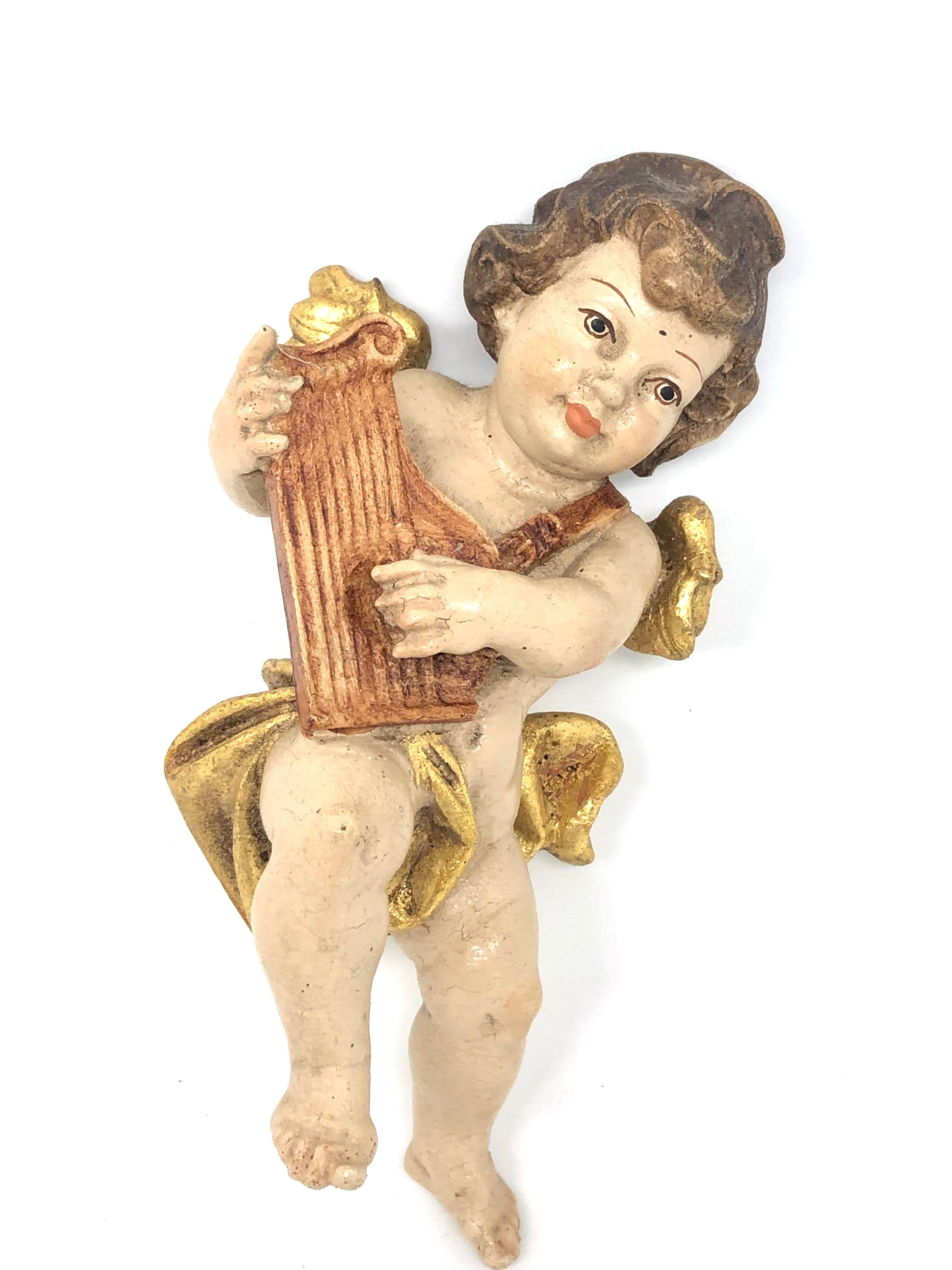 Beautiful hand carved cherub angel, found at an estate sale in Germany. Made by a woodcarver in the Oberammergau area in Germany, a well-known wood carving area in Germany. We believe that this piece is from the 1950s or older. A nice addition to