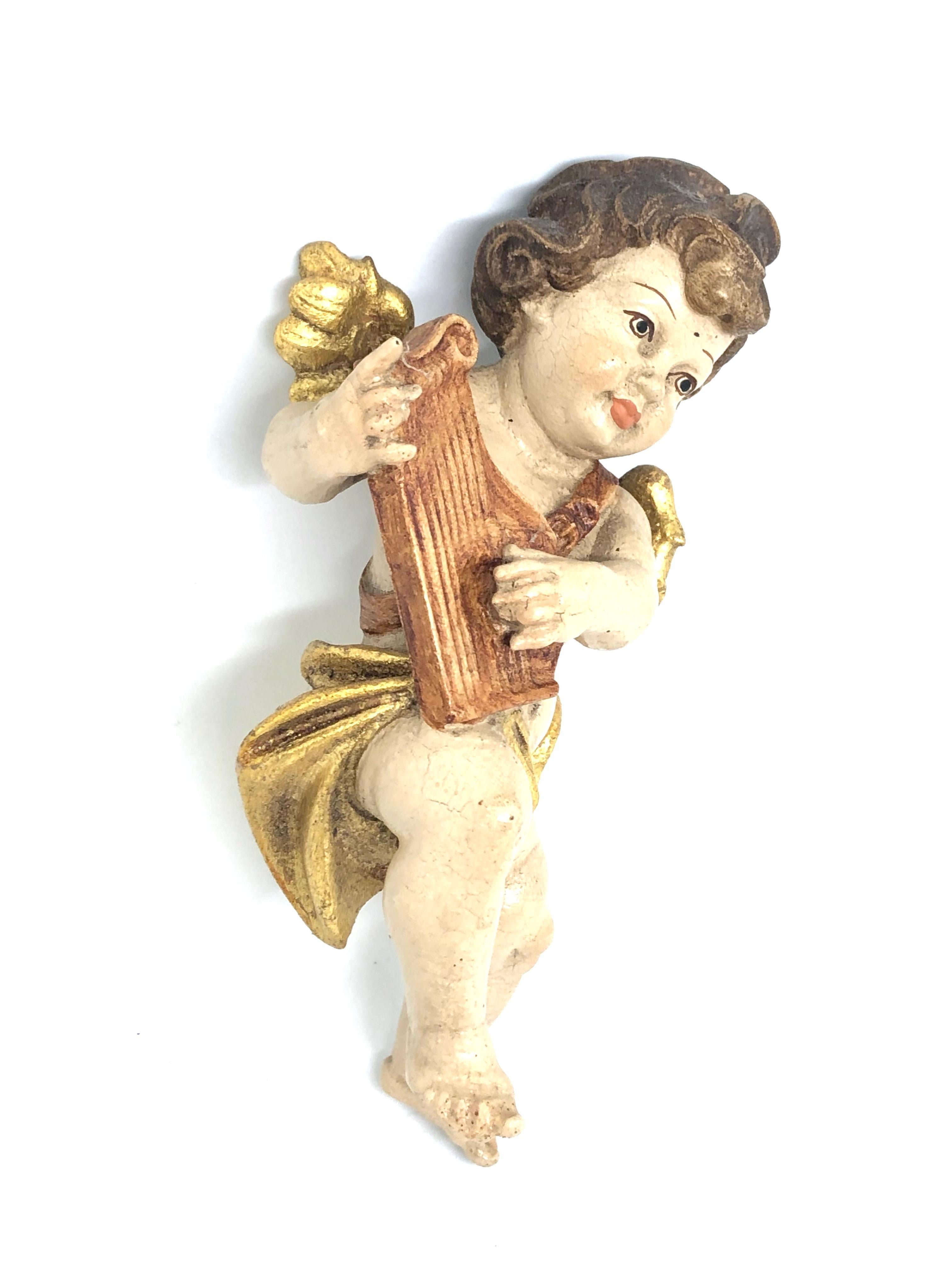 cherub playing harp