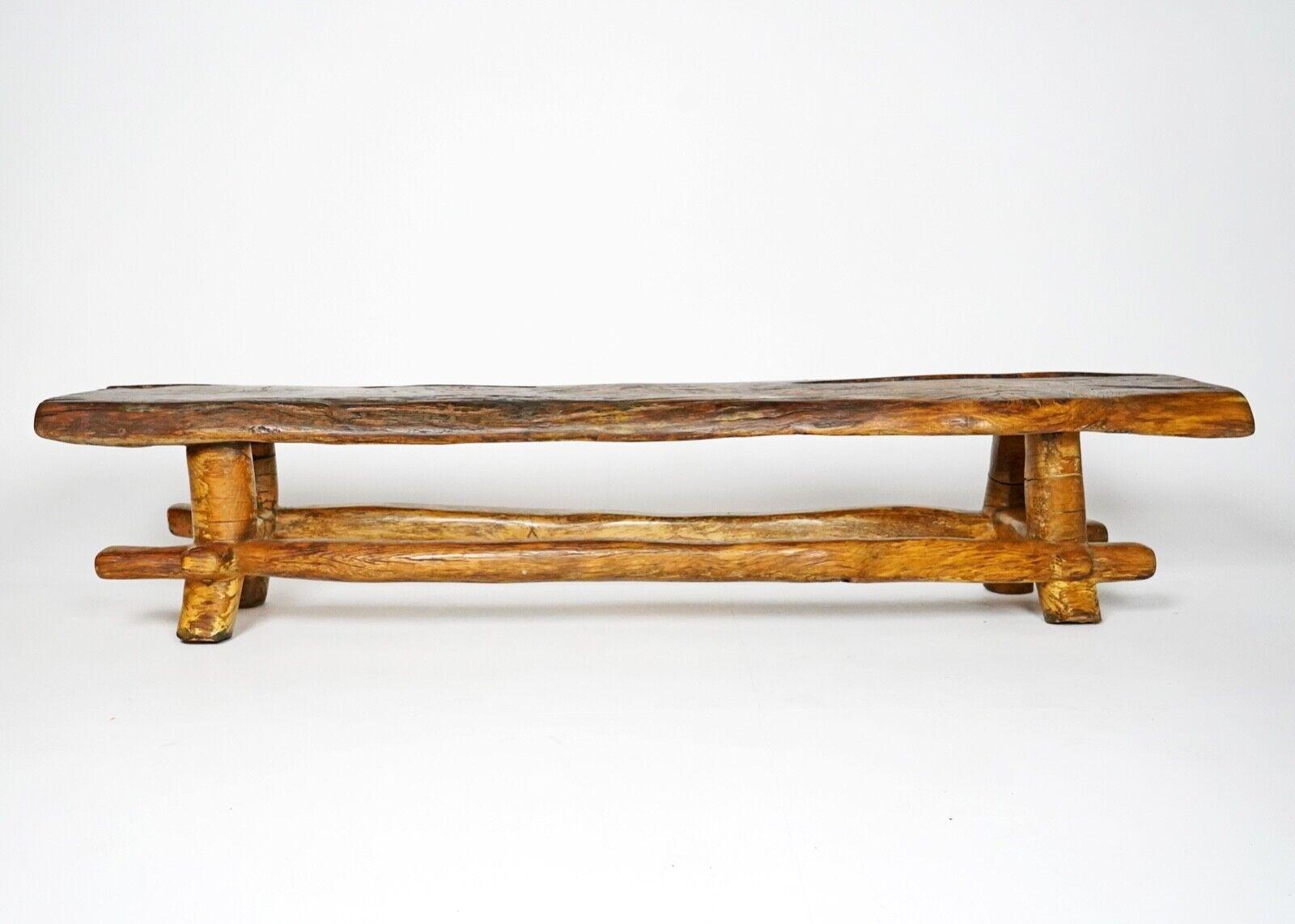 A beautifully tactile coffee table or bench carved from a single piece of oak.
Hand carved by the artist Maxie Lane, signed and dated 1988 on the underside. 
We think this piece could be used as a coffee table and in the right interior would be