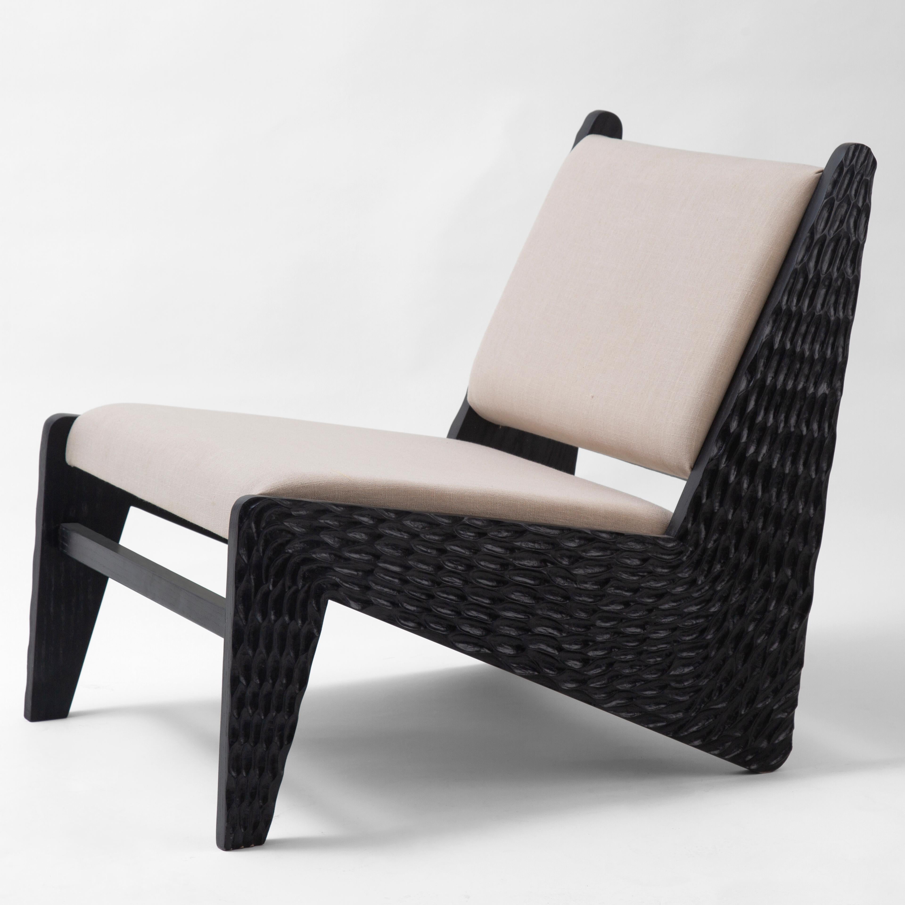 Hand carved oak lounge chair inspired by Nomadic Furniture of The Oases in Egypt.
Loungey and earthy, our SIWA armchair is a contemporary interpretation of the northern African nomadic lines. The design is simple with straight lines and subtle
