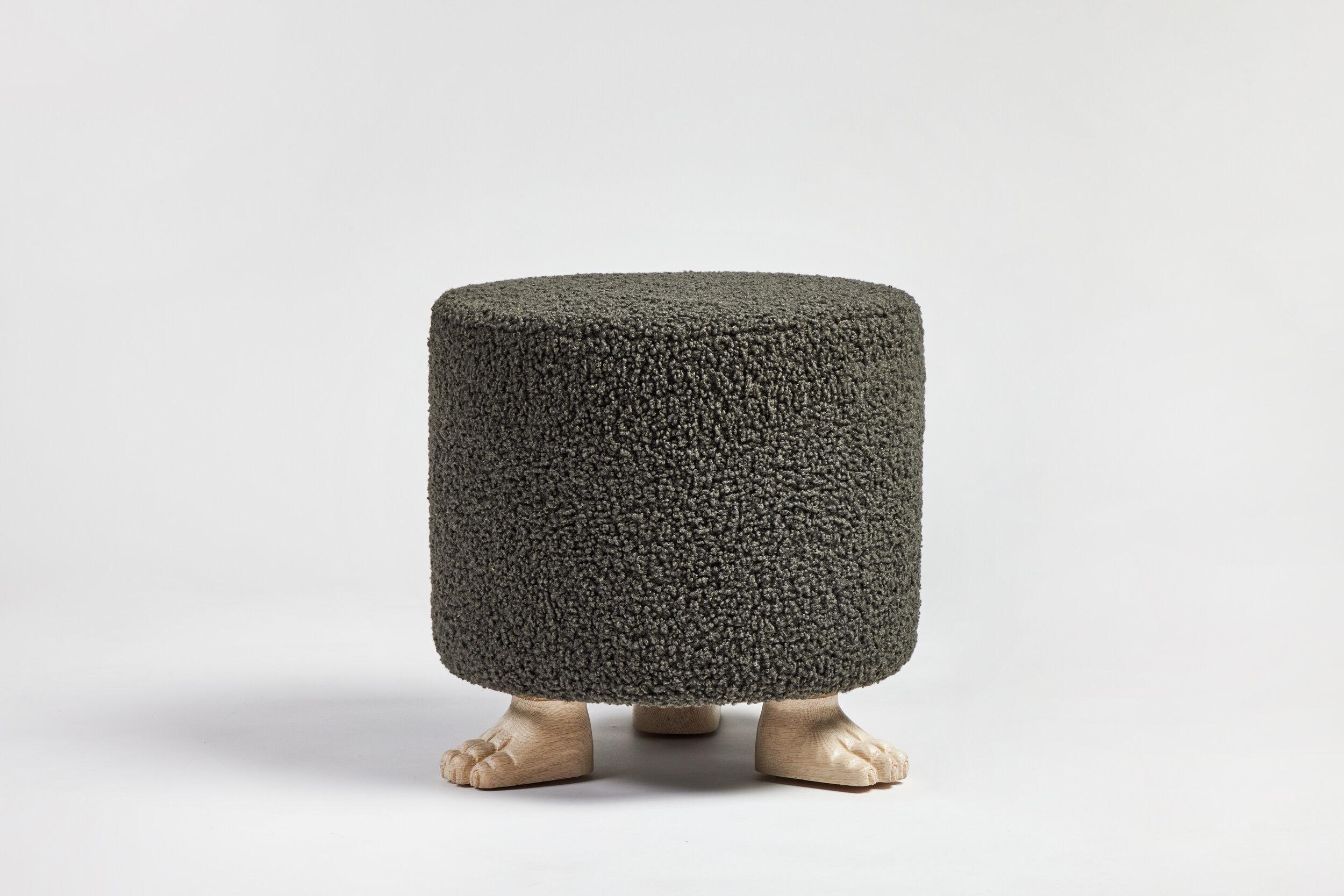Martin & Brockett's Lupa Ottoman is named after Lupa, the she-wolf mother of Rome. It features three hand-carved wooden feet, shown in our Bleached finish on Oak. The Lupa Ottoman is a whimsical seating option to float next to a cocktail table, pull