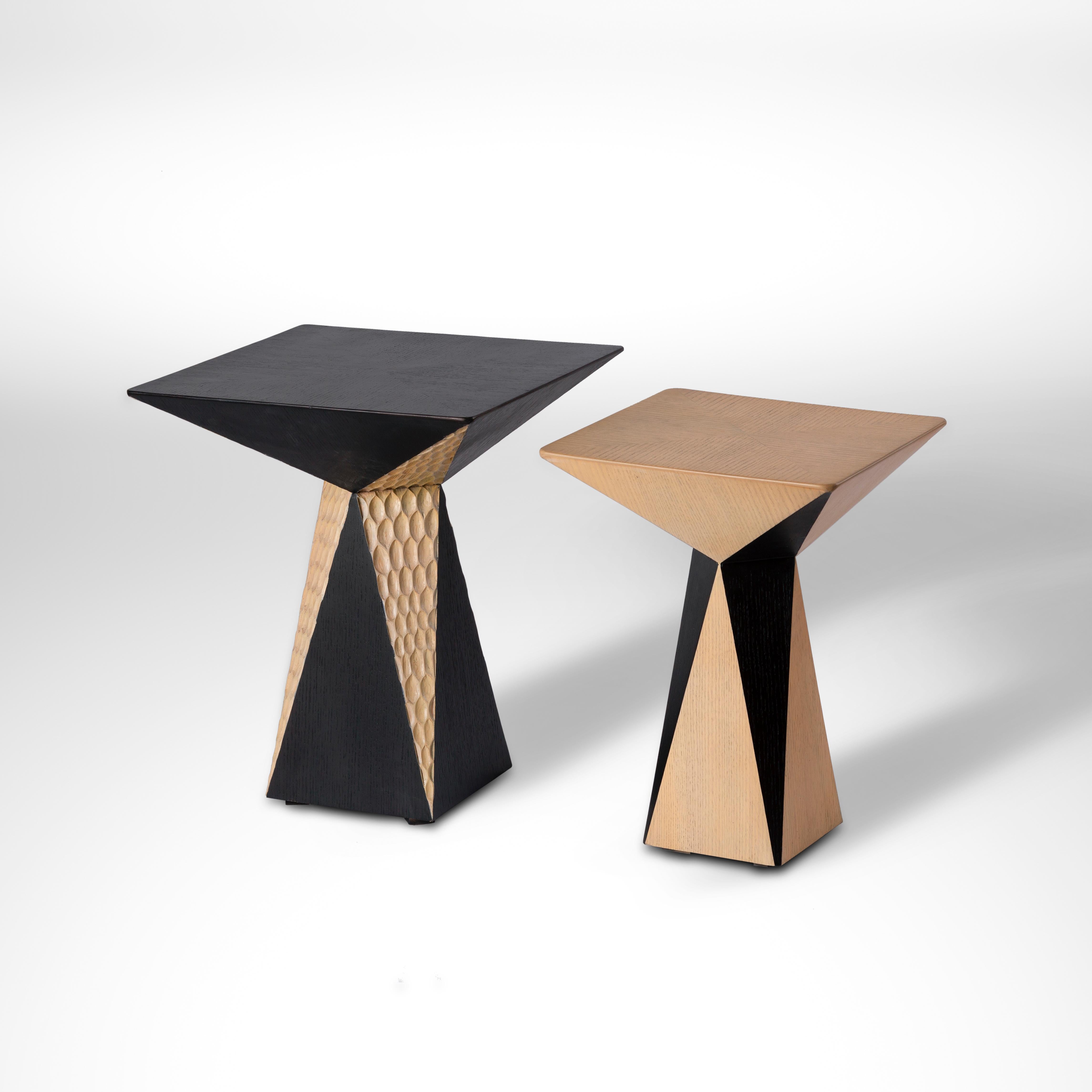 Hand carved oak side table inspired by Crystal Formations of the Oases in Egypt.
Our edgy CRYSTAL I accent table draws its silhouettes from the crystalline formations found near the Bahareya Oases. The contrasting lines and colors evoke the image