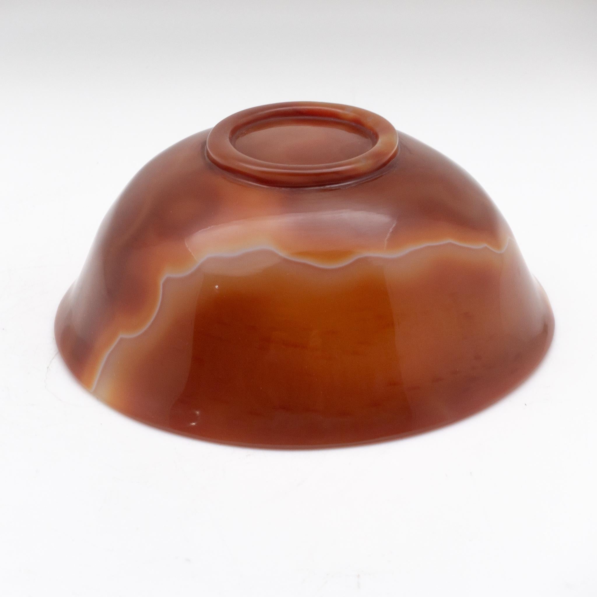 Hand caved orange agate semi-precious stone bowl, measures: 6.75