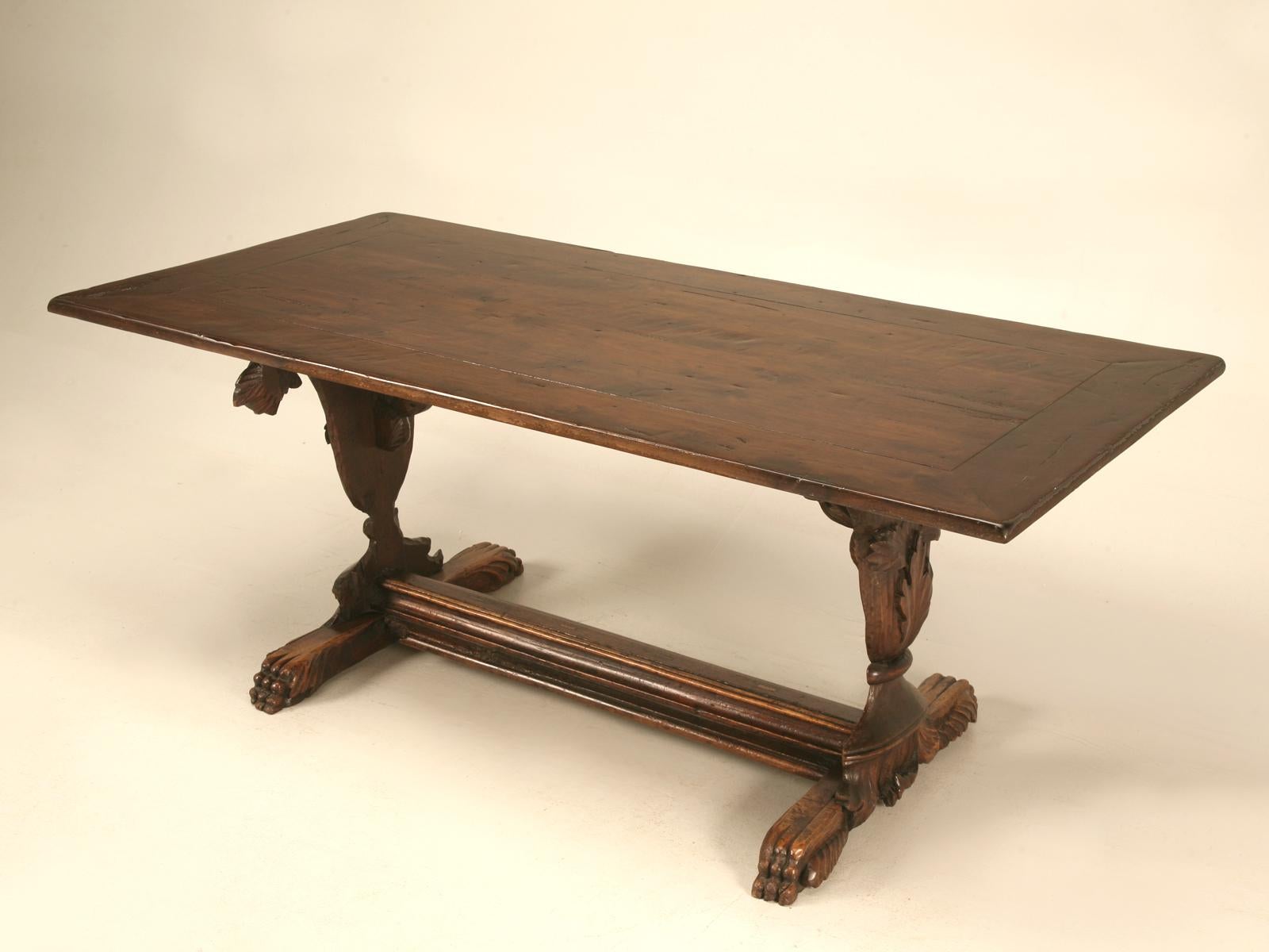 18th century hand carved solid walnut trestle table. This table offers breathtaking beauty with its incredible urn-form pedestals overflowing with decorative leaves and vines. Sturdy and solid construction showcase old world craftsmanship, as do the