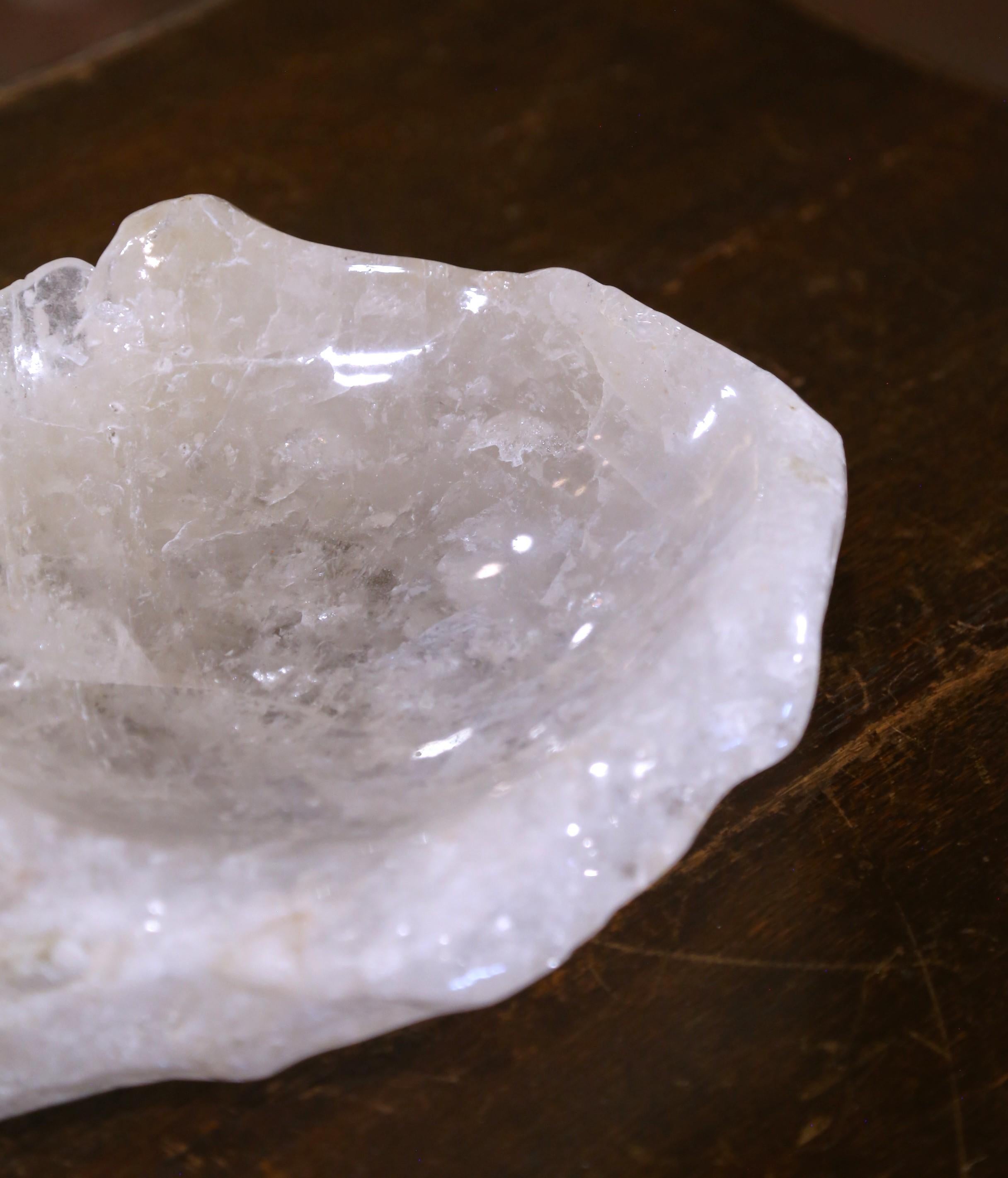 Place your keys or decorate an entry table or console with this substantial and luminous rock crystal bowl. Crafted in Brazil, the hand-carved dish features a rounded, organic form that highlights the natural clarity and veining of the crystal.
The