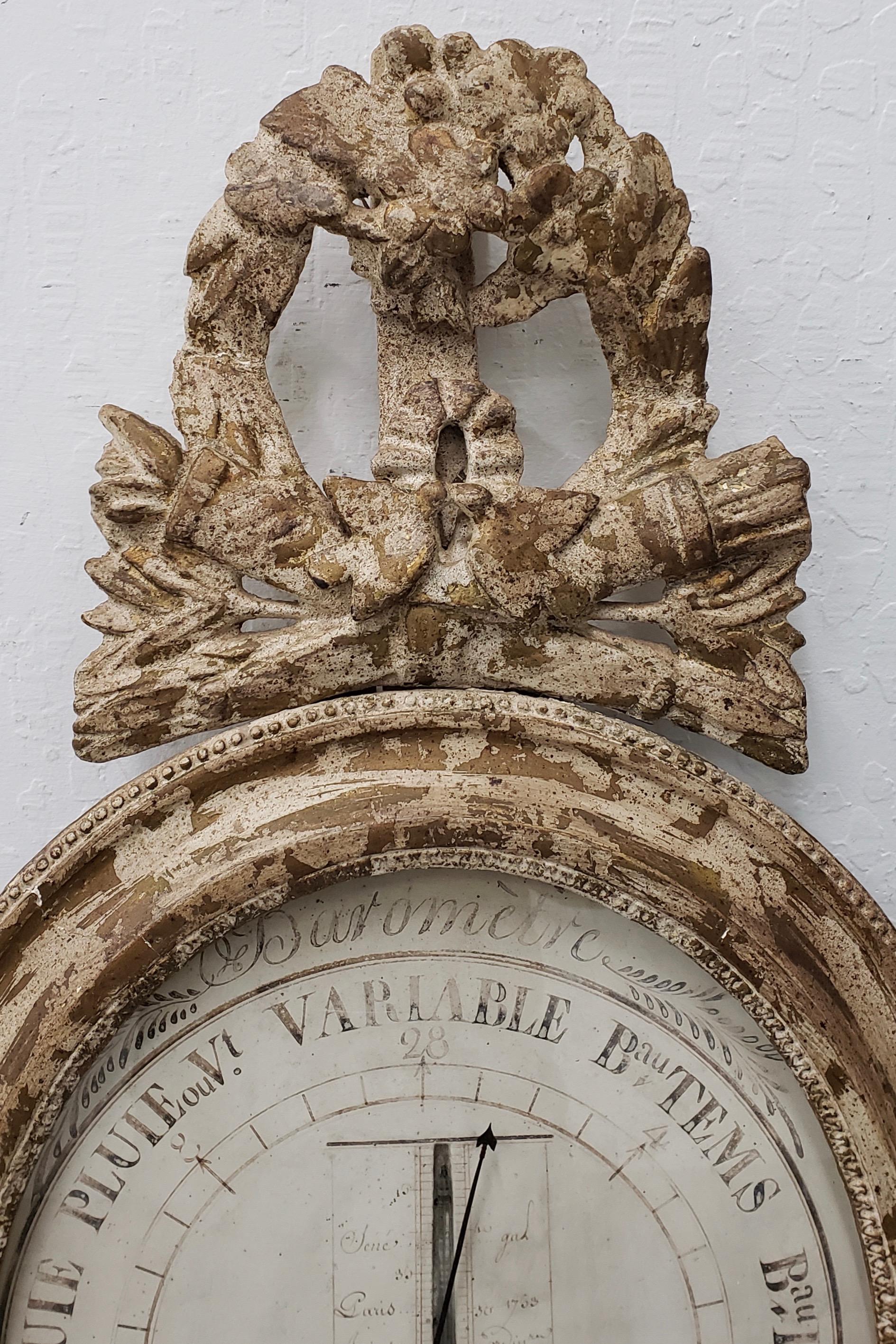 Hand carved and painted 18th century mercury barometer

Beautifully carved frame and a hand painted face. Ample remnants of the glass tube are still intact.

The original gilding has faded over the past 200+ years, leaving behind a rustic white