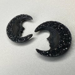 Hand carved pair of black druzy agate moon faces by Idar Oberstein masters.