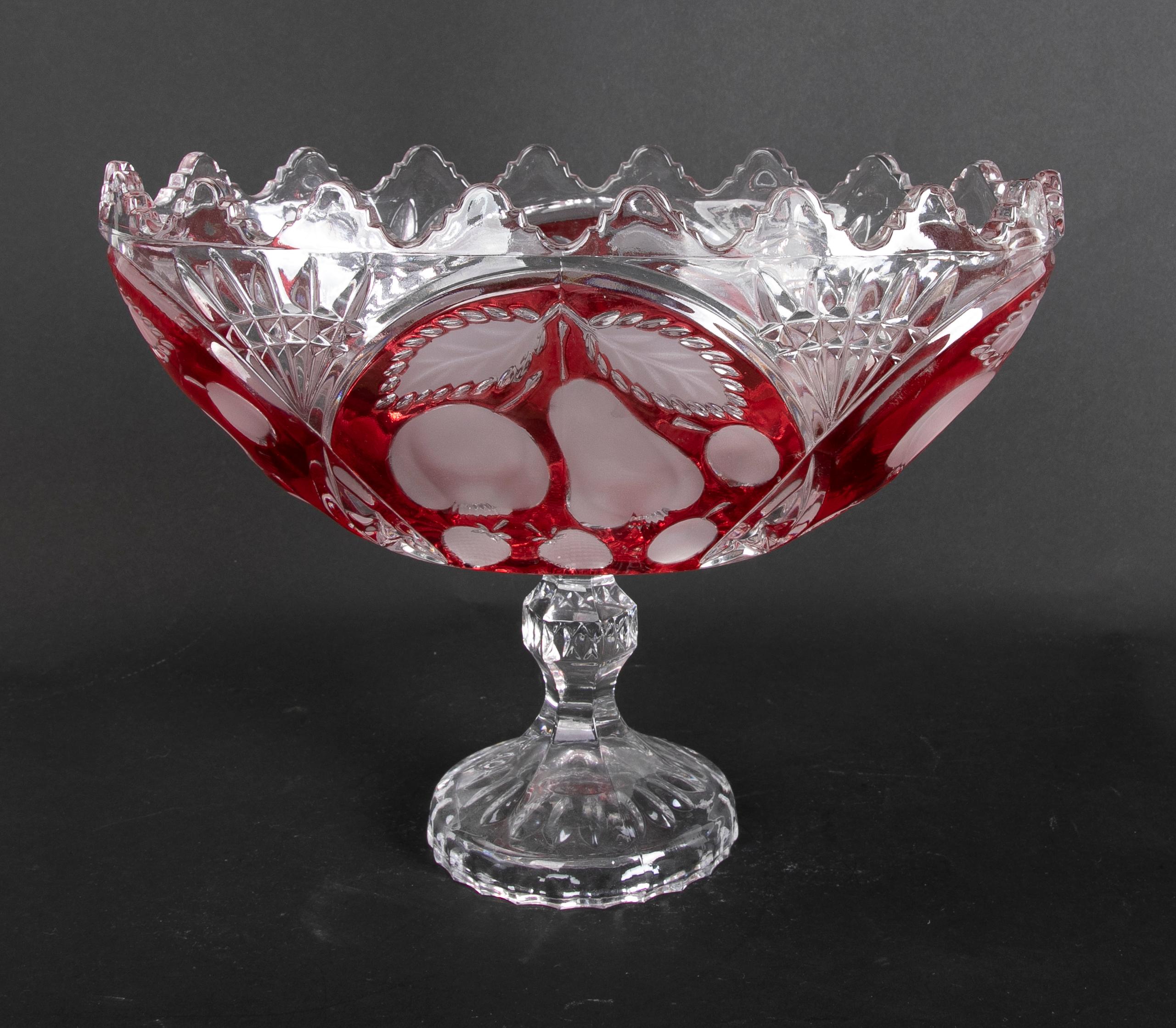 Hand-carved pair of oval crystal vases with red decoration.
