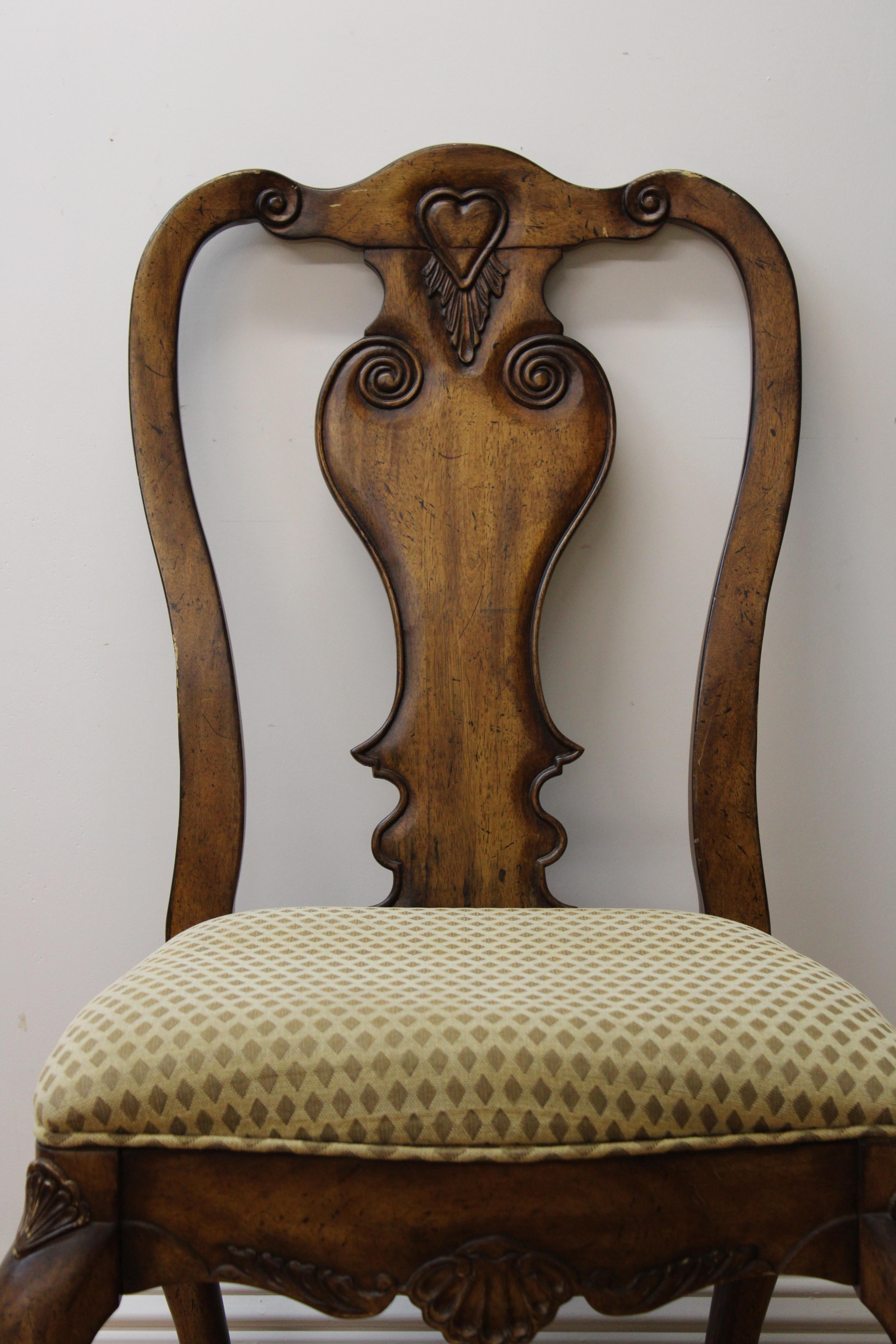 C. 20th century

Hand carved paw foot side chair w/ shell & heart decoration.