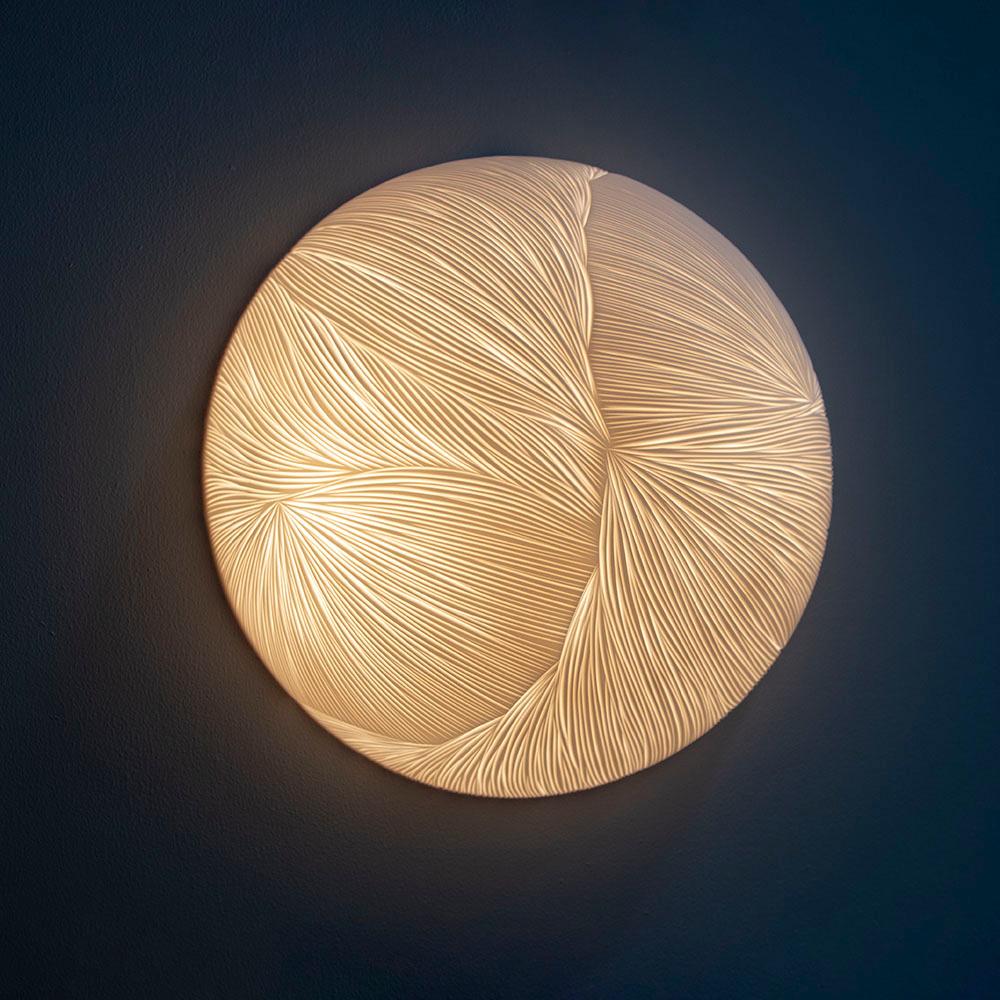 English Hand-carved porcelain and brass semi sphere wall sconce by Vezzini & Chen For Sale