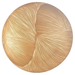 Hand-carved porcelain and brass semi sphere wall sconce by Vezzini & Chen