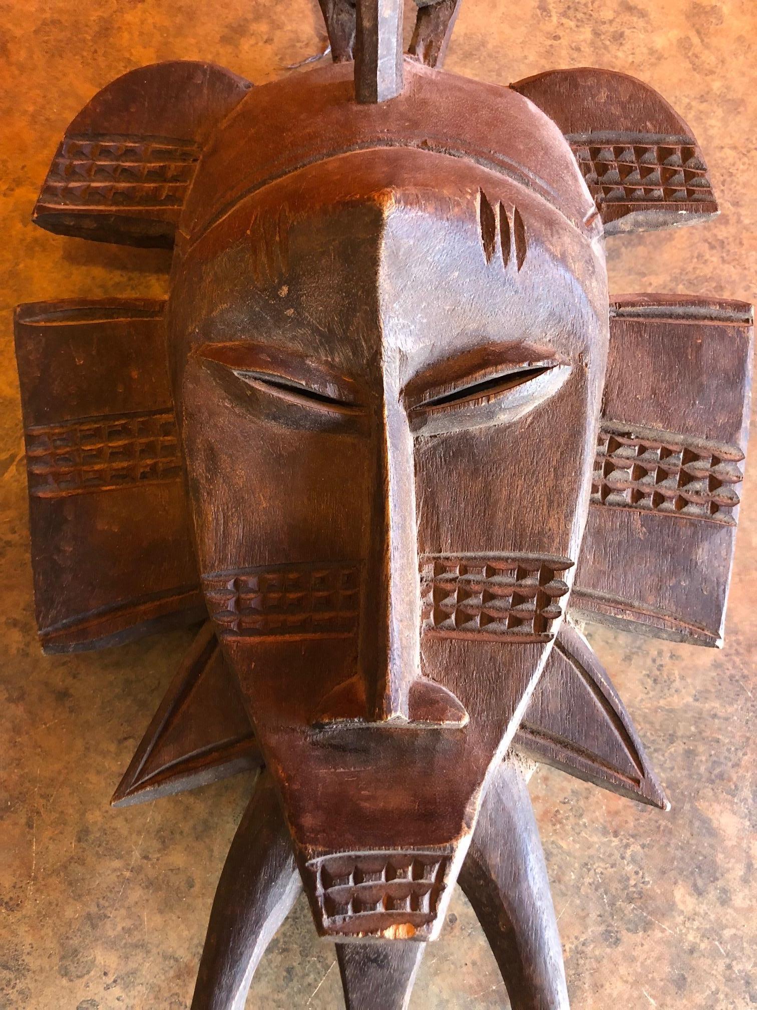 Hand-Carved Hand Carved Primitive Senufo Kpelie Tribal Mask from the Ivory Coast