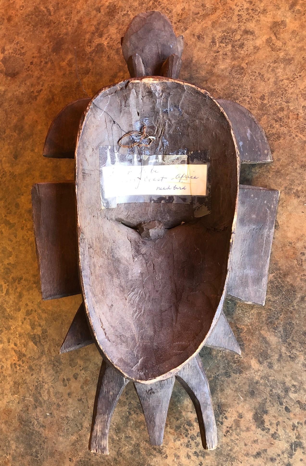 Hand Carved Primitive Senufo Kpelie Tribal Mask from the Ivory Coast In Good Condition In San Diego, CA