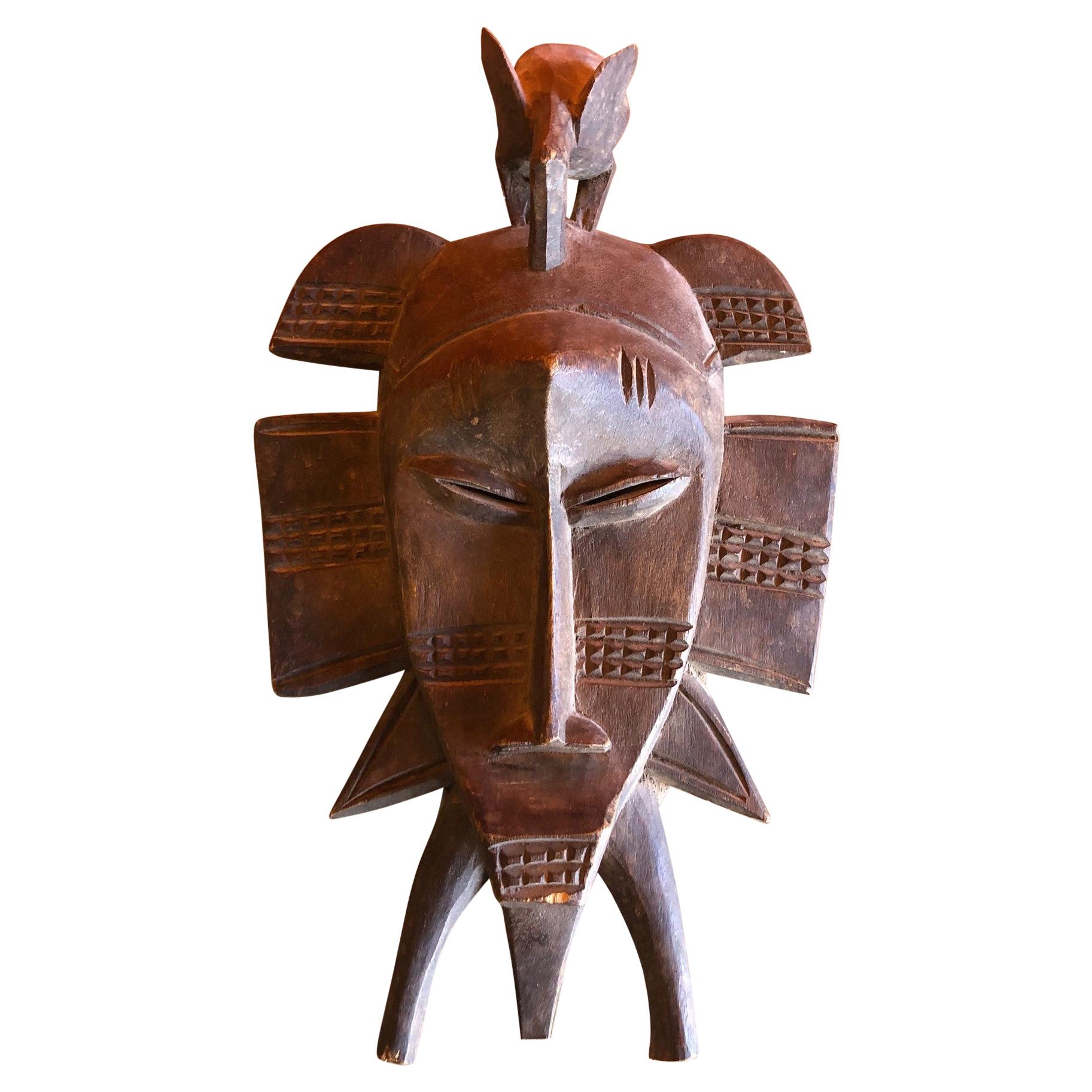 Hand Carved Primitive Senufo Kpelie Tribal Mask from the Ivory Coast
