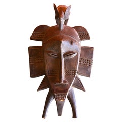 Hand Carved Primitive Senufo Kpelie Tribal Mask from the Ivory Coast