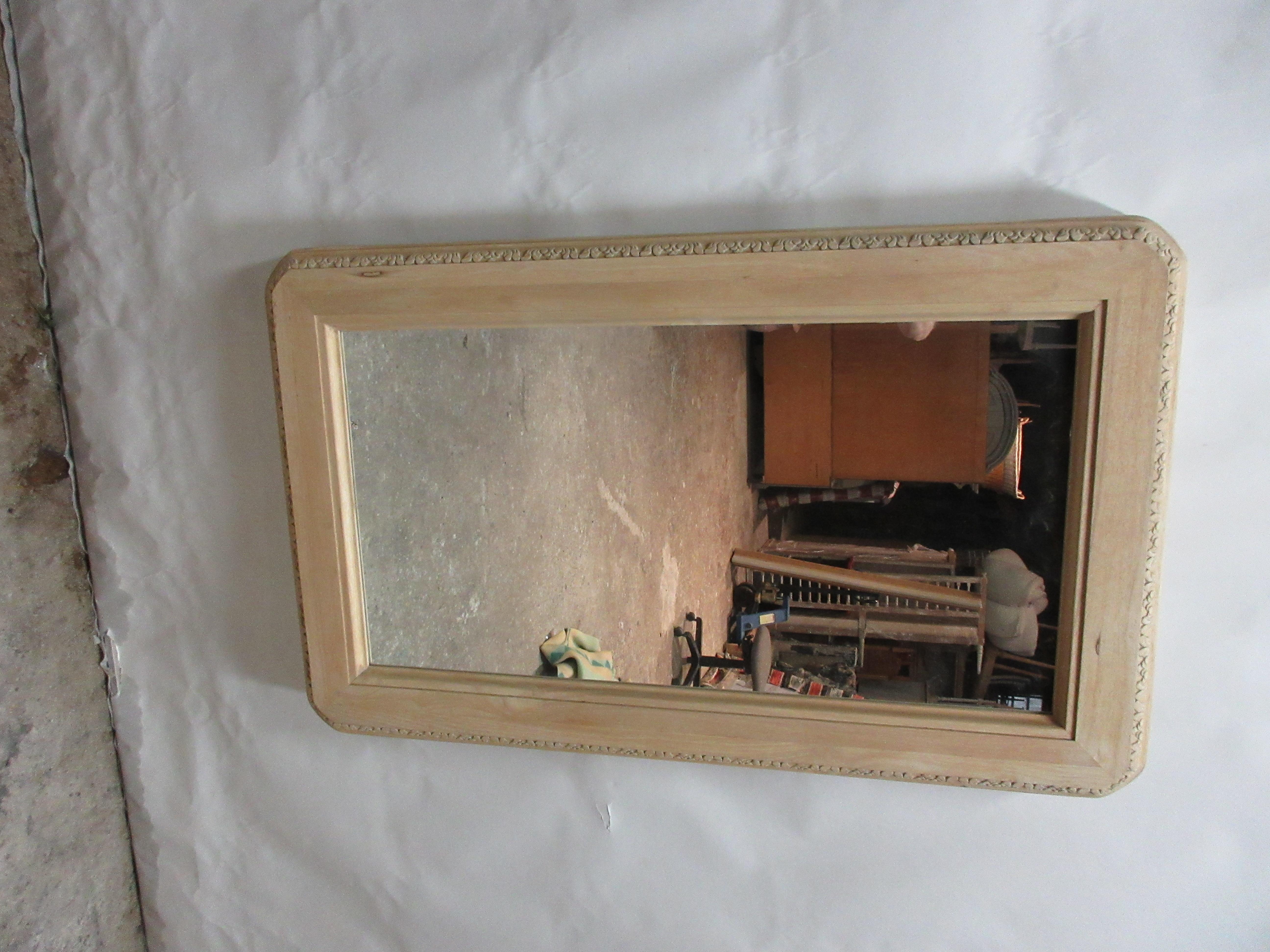 This is a really nice and unusual Hand Carved rectangular mirror. it had a dark wood stain on it and I thought it would look much better stripped to raw wood.