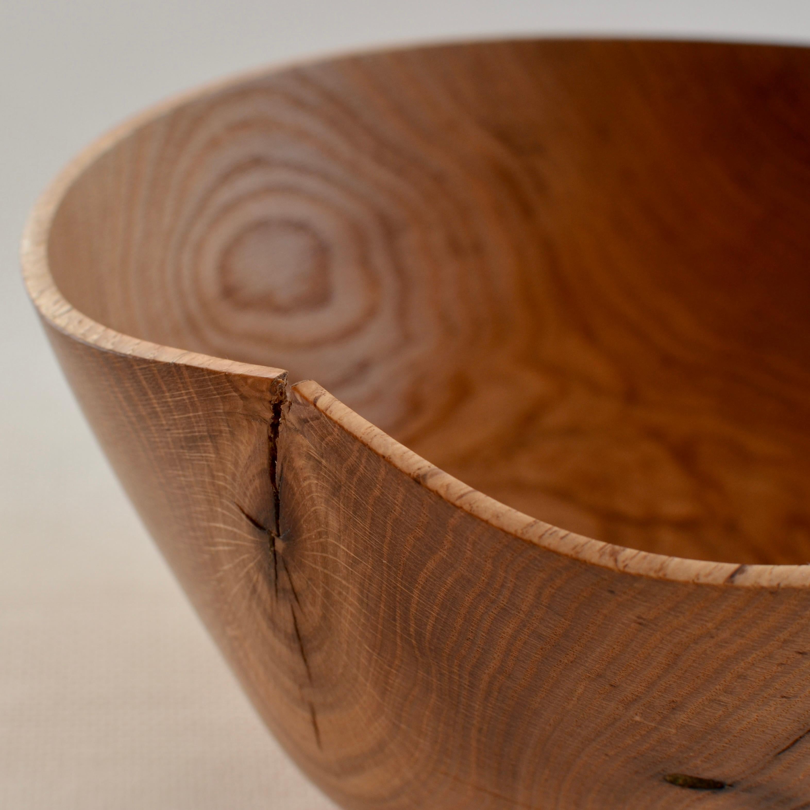 Hand-carved red oak wood bowl with natural warping and holes. Created using wood only from fallen Oak trees. One of a kind.
 
