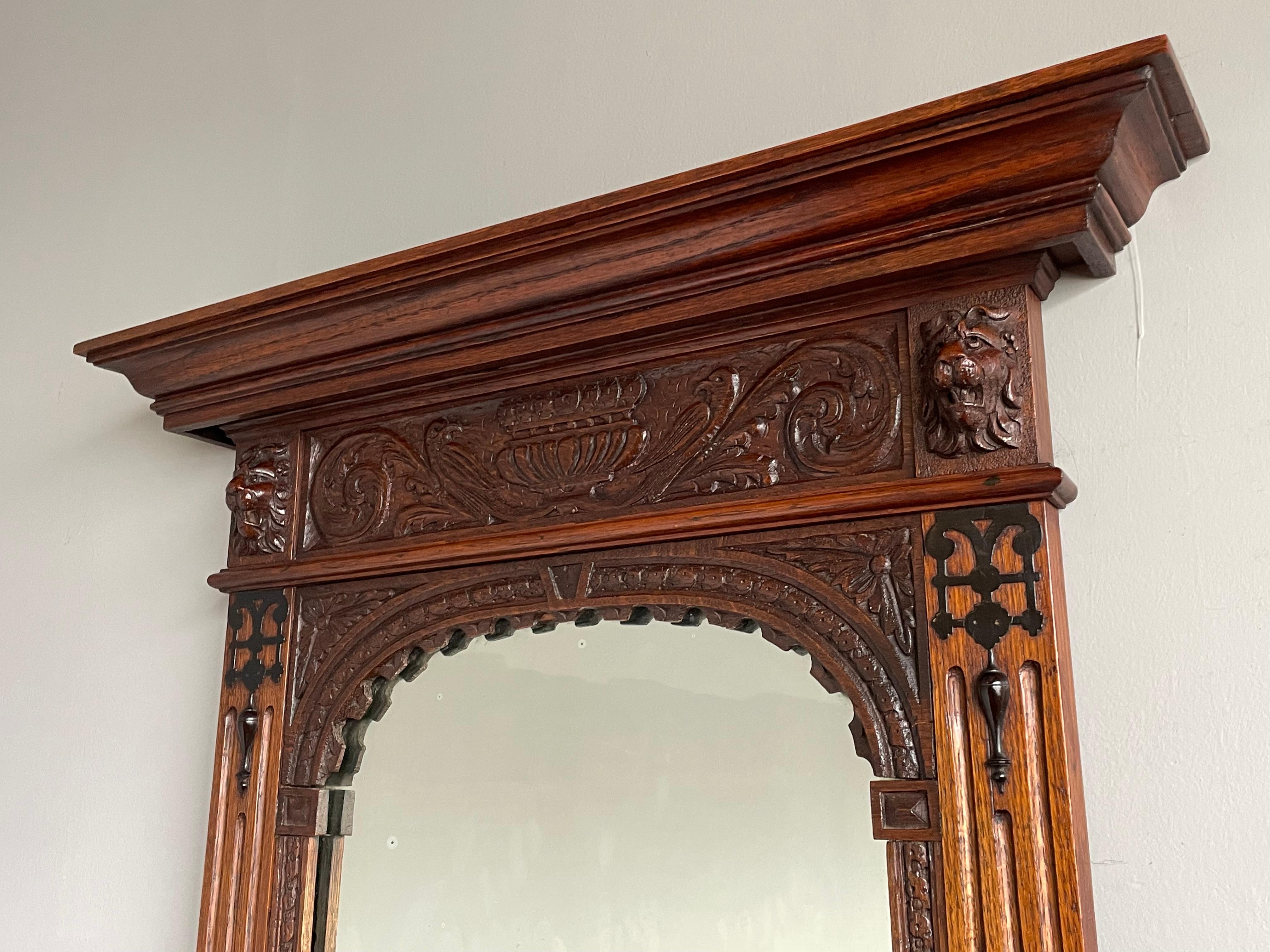 Exceptional antique hallway mirror with hand carved lions sculptures.

This stunning, Dutch Renaissance Revival entry hall mirror is a marvelous antique to come home to, but it also helps you to look your finest just before leaving. The very well