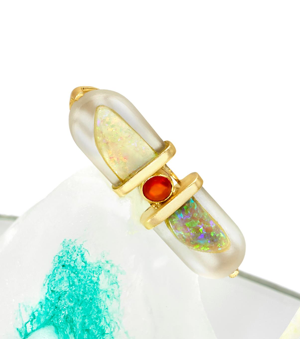 This modern handmade British-London Hallmarked 18 karat yellow gold ring, set with hand-carved abstract shape rock crystal and colorful opal including fire opal in the center is from MAIKO NAGAYAMA's Haute Couture Collection called 