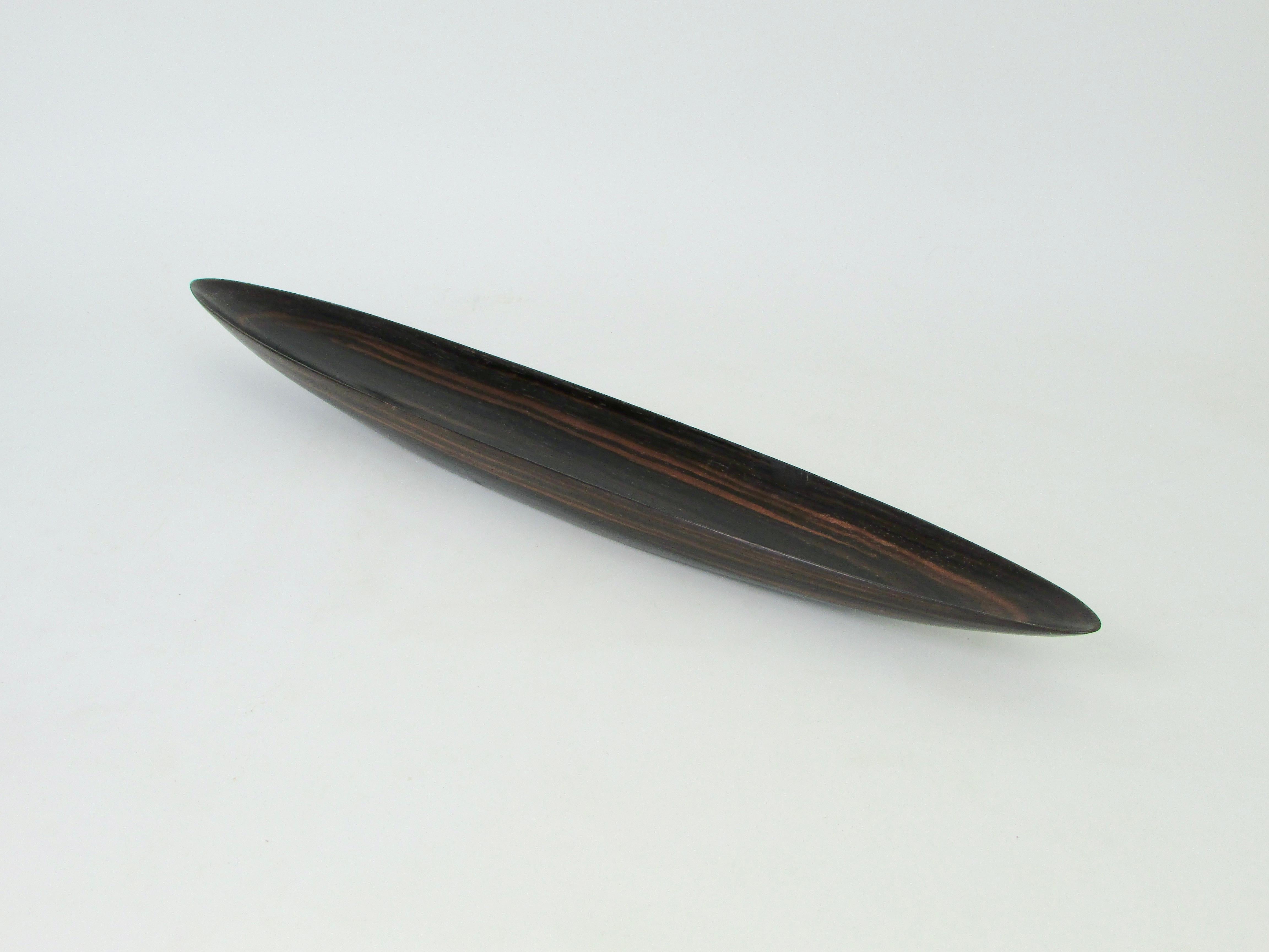 Beautifully formed long tapering Rosewood dish . Hand carved from single solid piece of Rosewood . Unsure on its origins . 