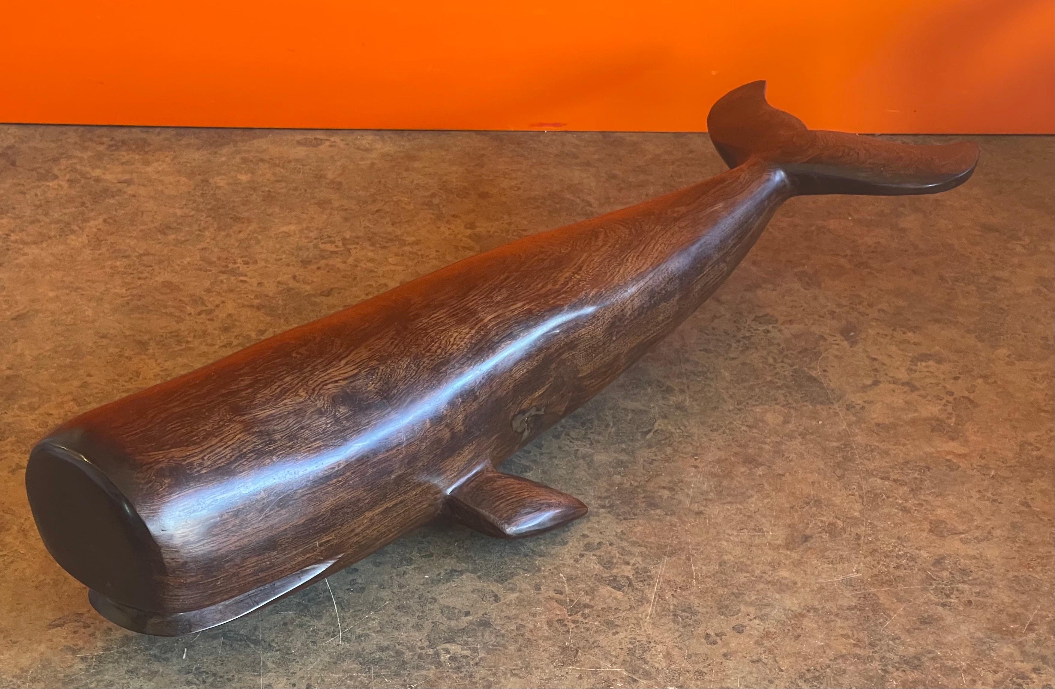 A very cool hand carved rosewood sperm whale, circa 1980s. The piece is in very good vintage condition and measures a massive 7