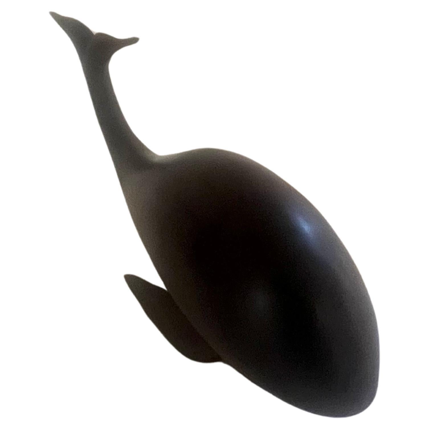 A very cool hand carved rosewood sperm whale, circa the 1980s. The piece is in great condition.