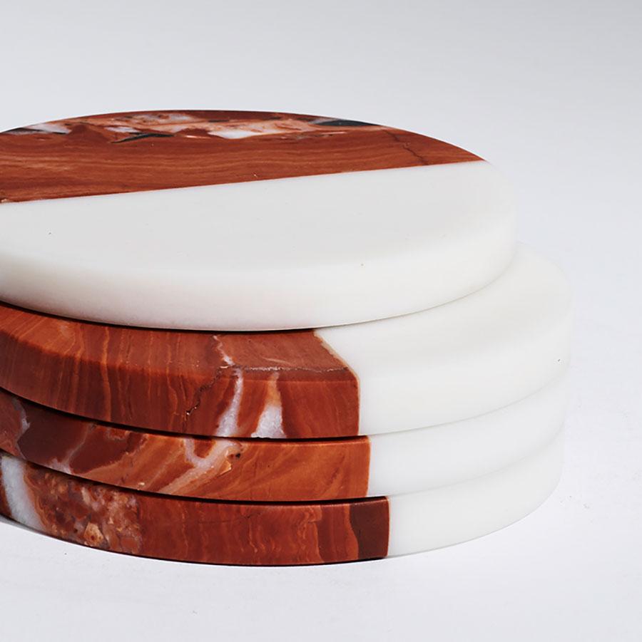These polar coasters juxtapose the vibrant beauty of Rosso marble with our crisp white Bianco marble in an elegant set of four, each piece honed by hand and finished with a black felt base.

Dimensions: D 100 x 10 H mm each piece
Materials: Rosso