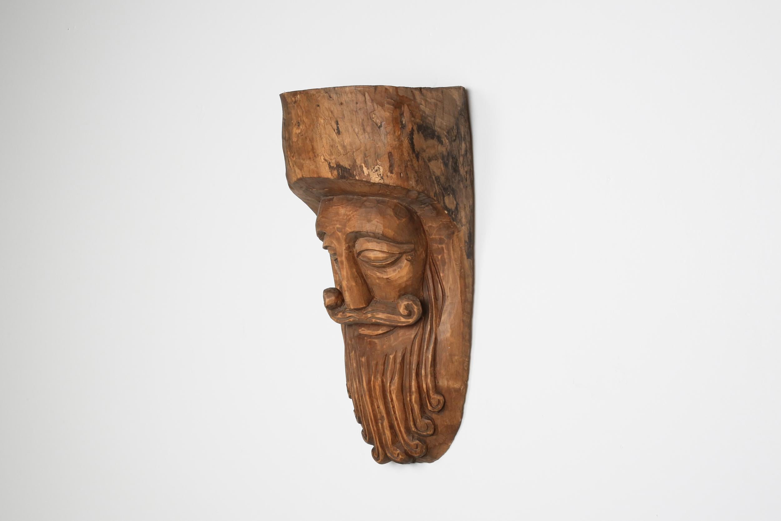 Rustic; folk art; mask; Axel Vervoordt

This Rustic looking mask has a soft and elegant expression, closed eyes, and a finely carved mustache.
The encrusted patina inside and out from traditional use. 

Would fit well in an Axel Vervoorst style