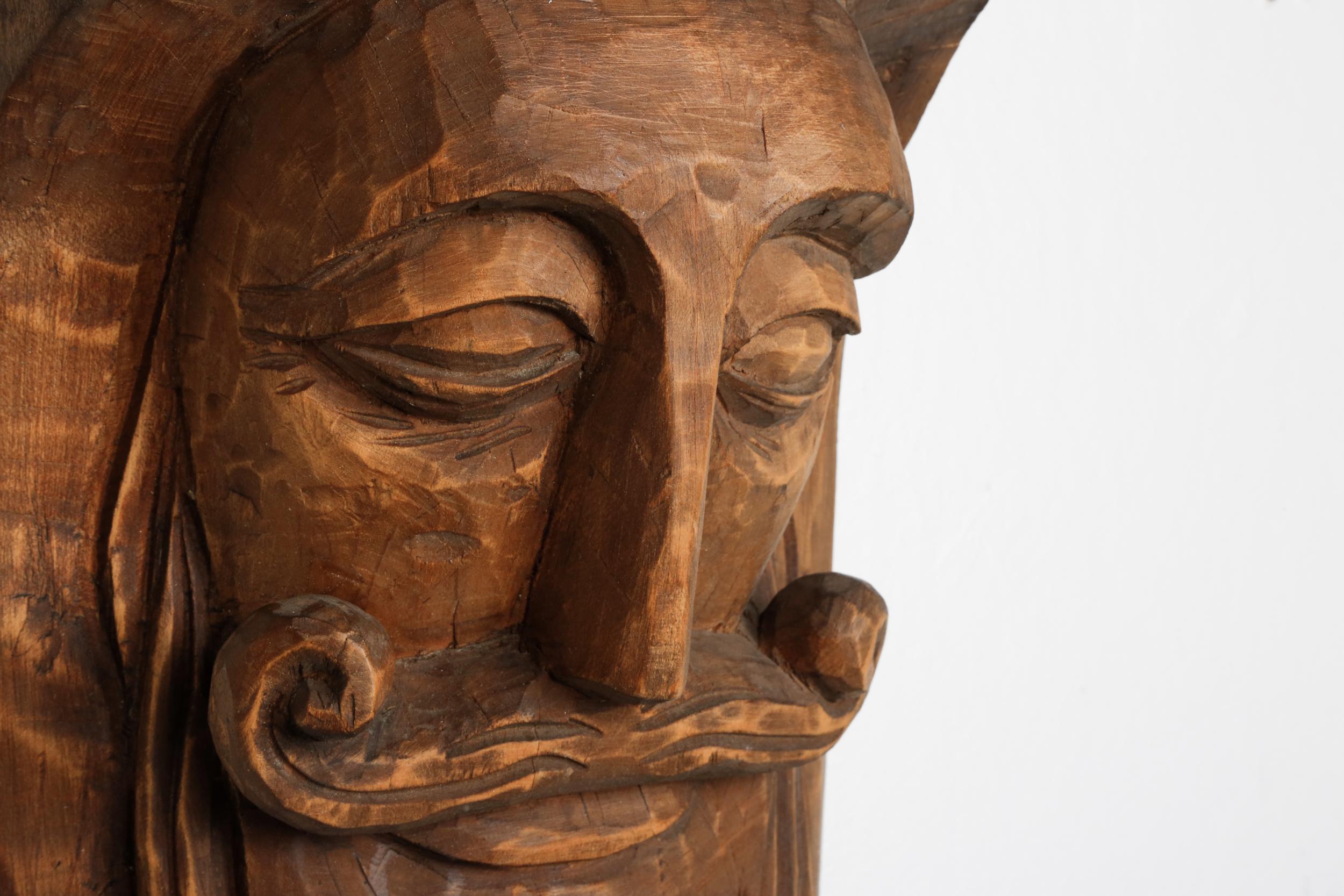 European Hand-Carved Rustic Wooden Mask with Soft Expression For Sale