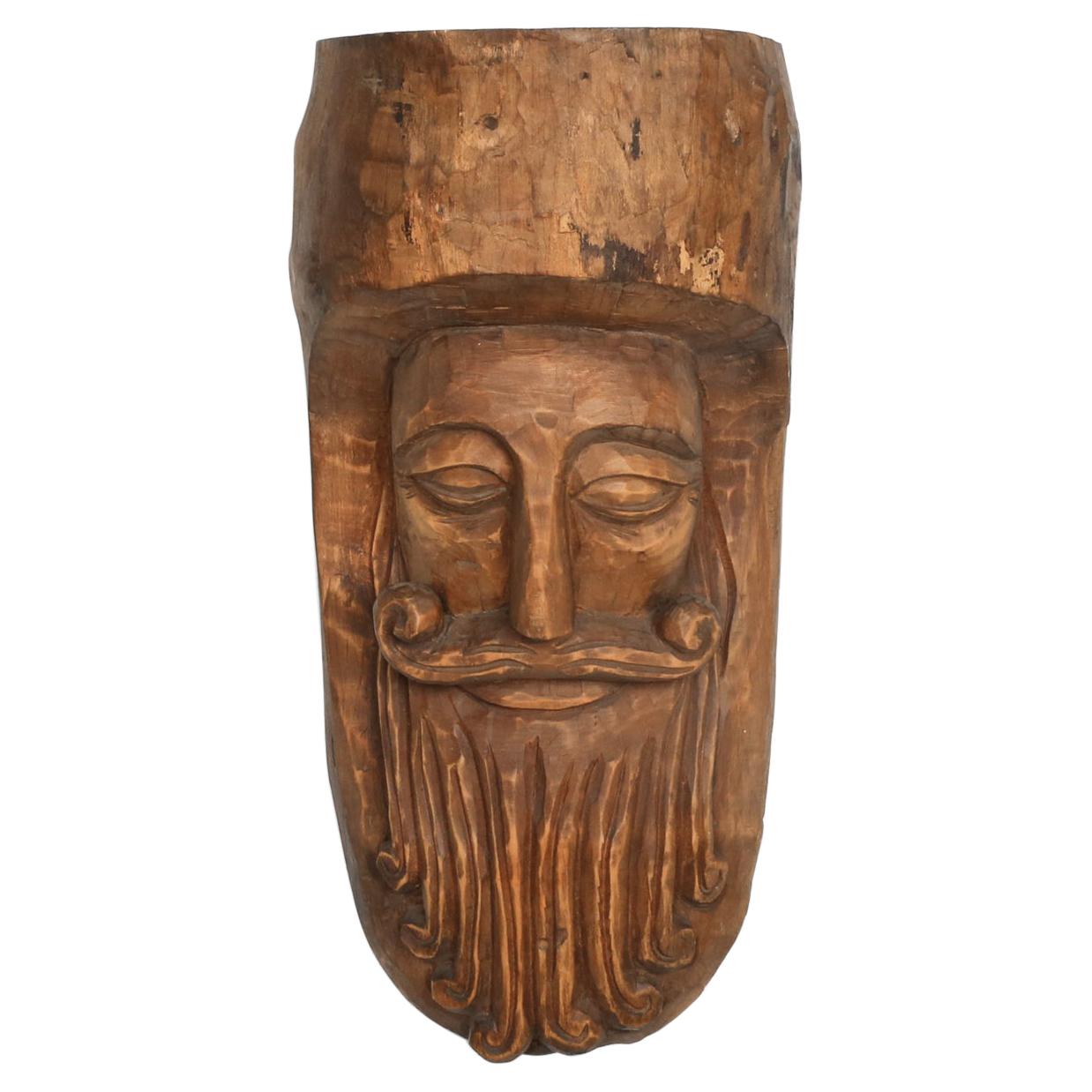 Hand-Carved Rustic Wooden Mask with Soft Expression For Sale