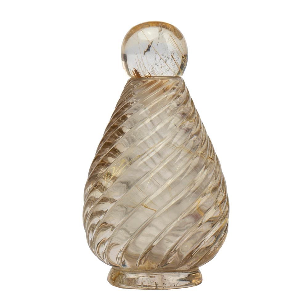 A beautiful perfume bottle or flacon, the smoky rutilated quartz tear-drop shaped body entirely hand carved in the classical manner with a spiraling design. Fitted with a rutilated quartz slip on cover. 

Created by Abdul Zuber, Jaipur India.

2 in.