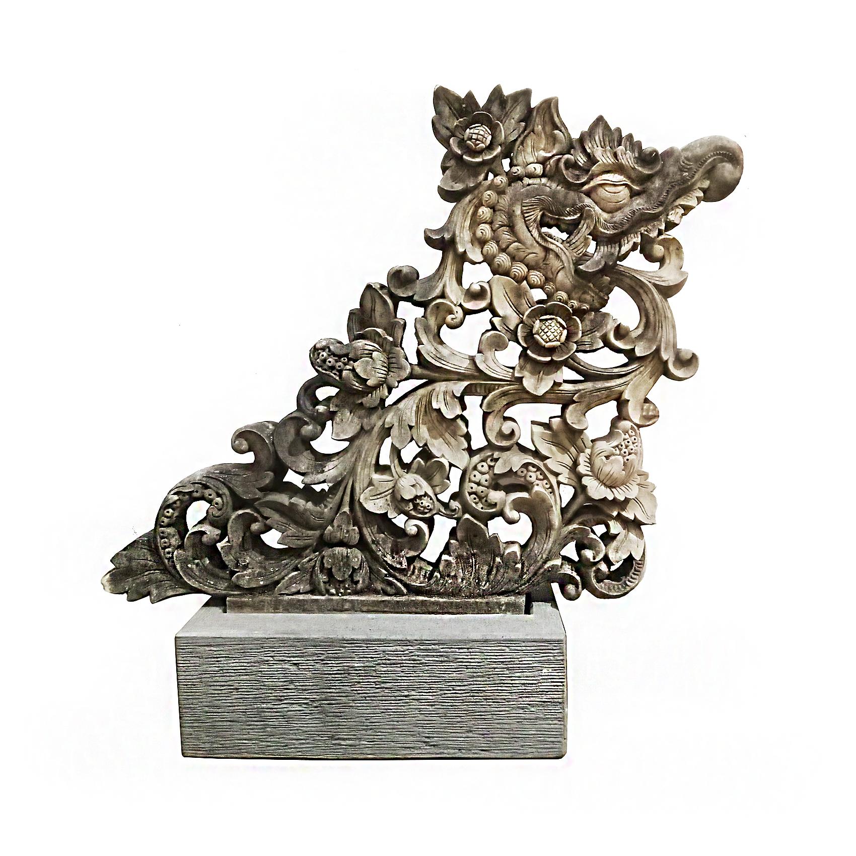 A superb stone sculpture of a dragon and flowers. Indonesia, early 20th Century. 

Reclaimed from an old building, this exquisite carving was an architectural detail that reflects the old traditions of Asian sculpture. With intricate details
