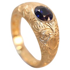 Anillo de oro con zafiro azul no calentado de 1,03 quilates con intrincado tallado a mano
