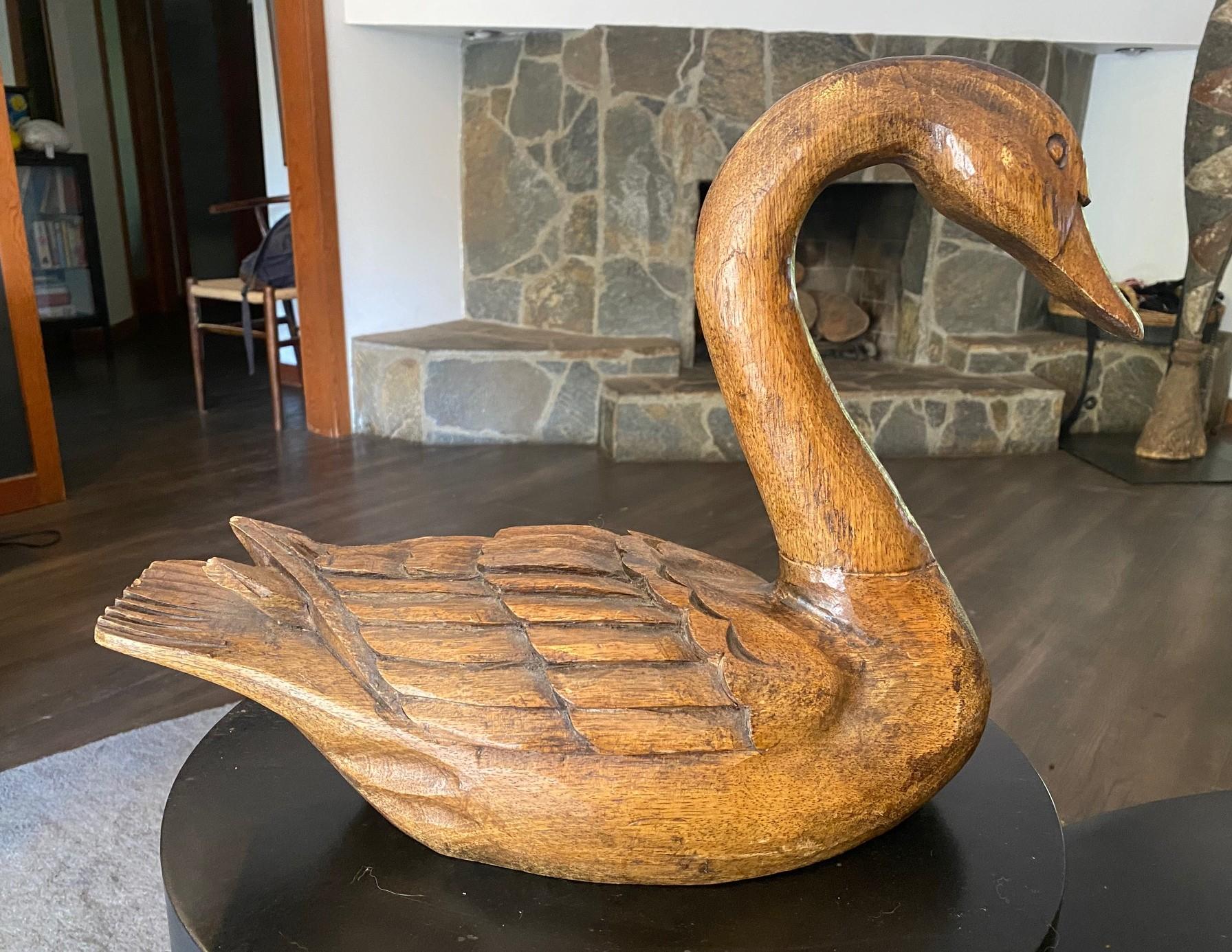 A fantastic, large hand-carved swan decoy with a beautiful, natural glowing patina that comes with age. This piece has a wonderful classic shape and finely carved texture.

The work is signed by the artist (Esmer) and dated (1929) on the