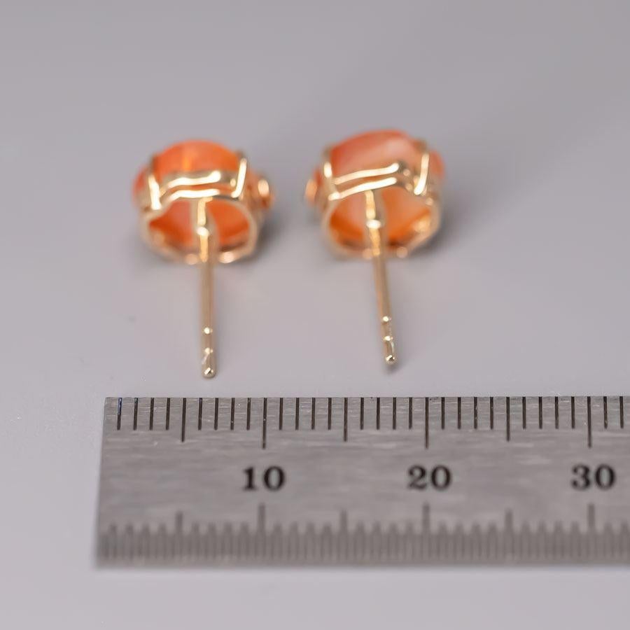 Women's or Men's Hand Carved Skull with Diamond Bows Fire Opal Stud Earrings 18k Gold For Sale