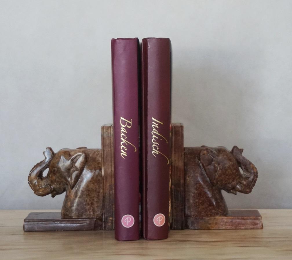 A pair of soapstone elephant bookends hand carved, detailed and polished. The color of each piece may differ a little bit, as soapstone is a natural product and therefore not uniform. These lovely bookends are heavy yet delicate and would elegantly