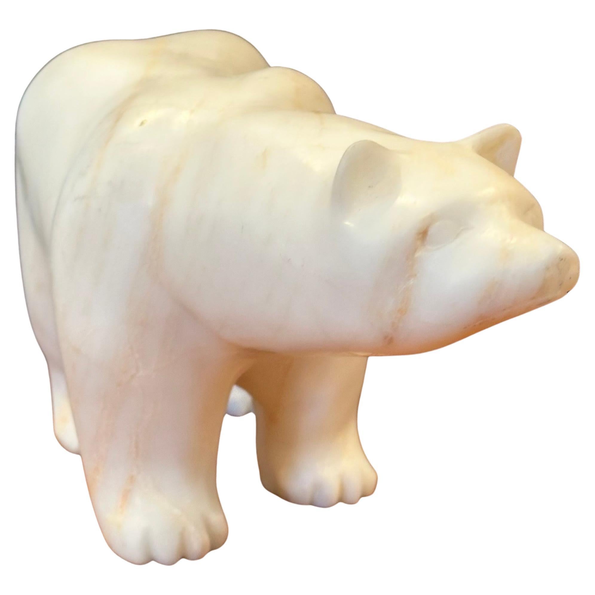 A very nice hand carved solid alabaster polar Bear sculpture, circa 1970s. The piece is in very good vintage condition with no chips or cracks and measures 11