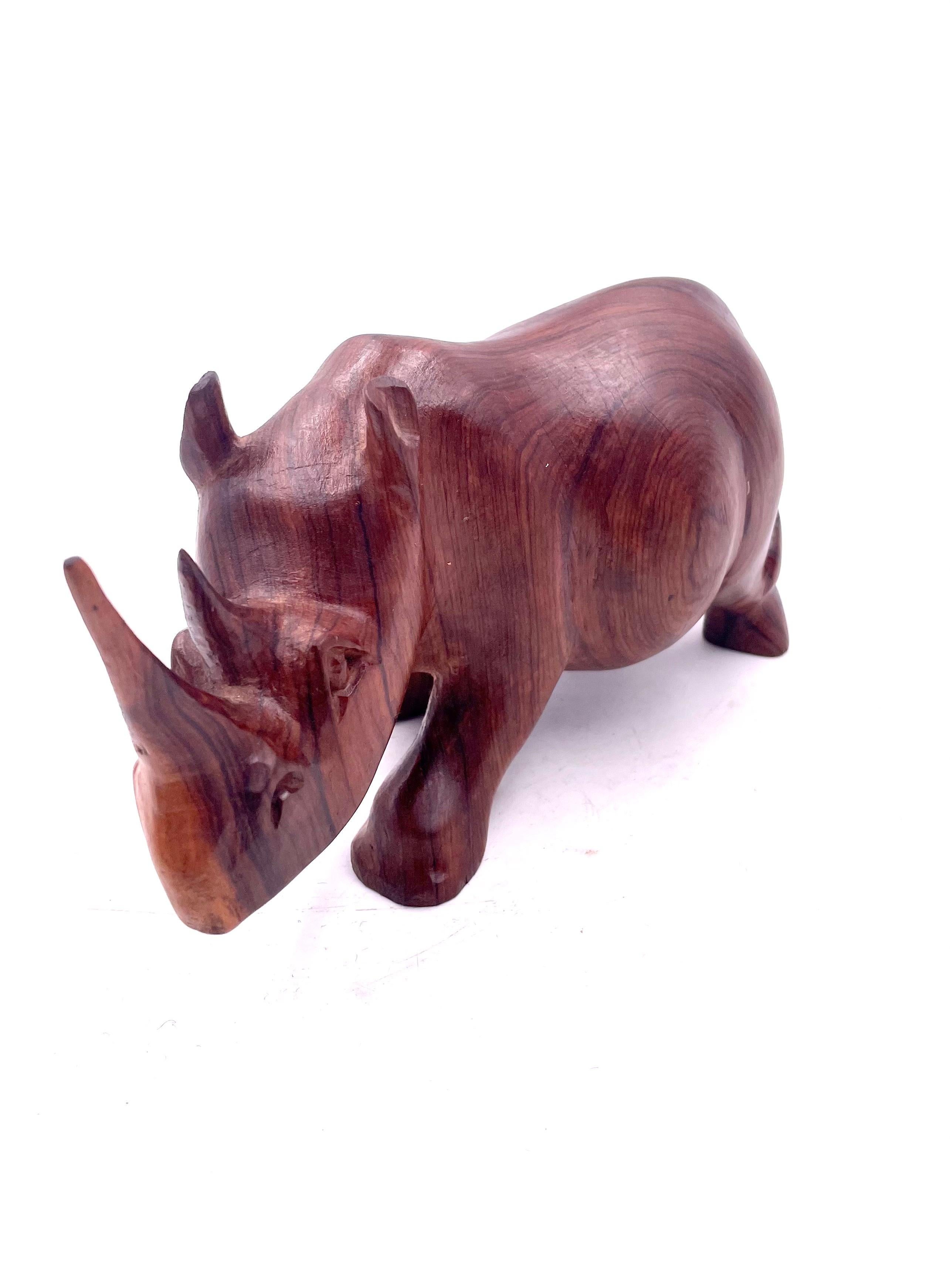A very cool hand-carved solid walnut rhino sculpture, circa 1980s. The piece is in great condition we have cleaned an oiled the piece.