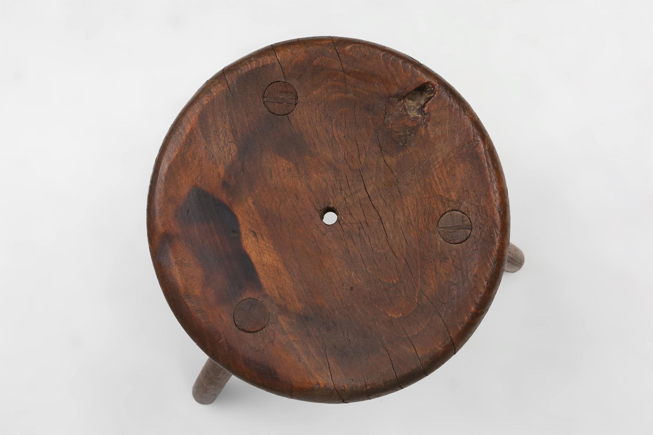 Hand-Carved Hand-carved solid wood tripod stool with beautiful patina, France ca. 1900 For Sale
