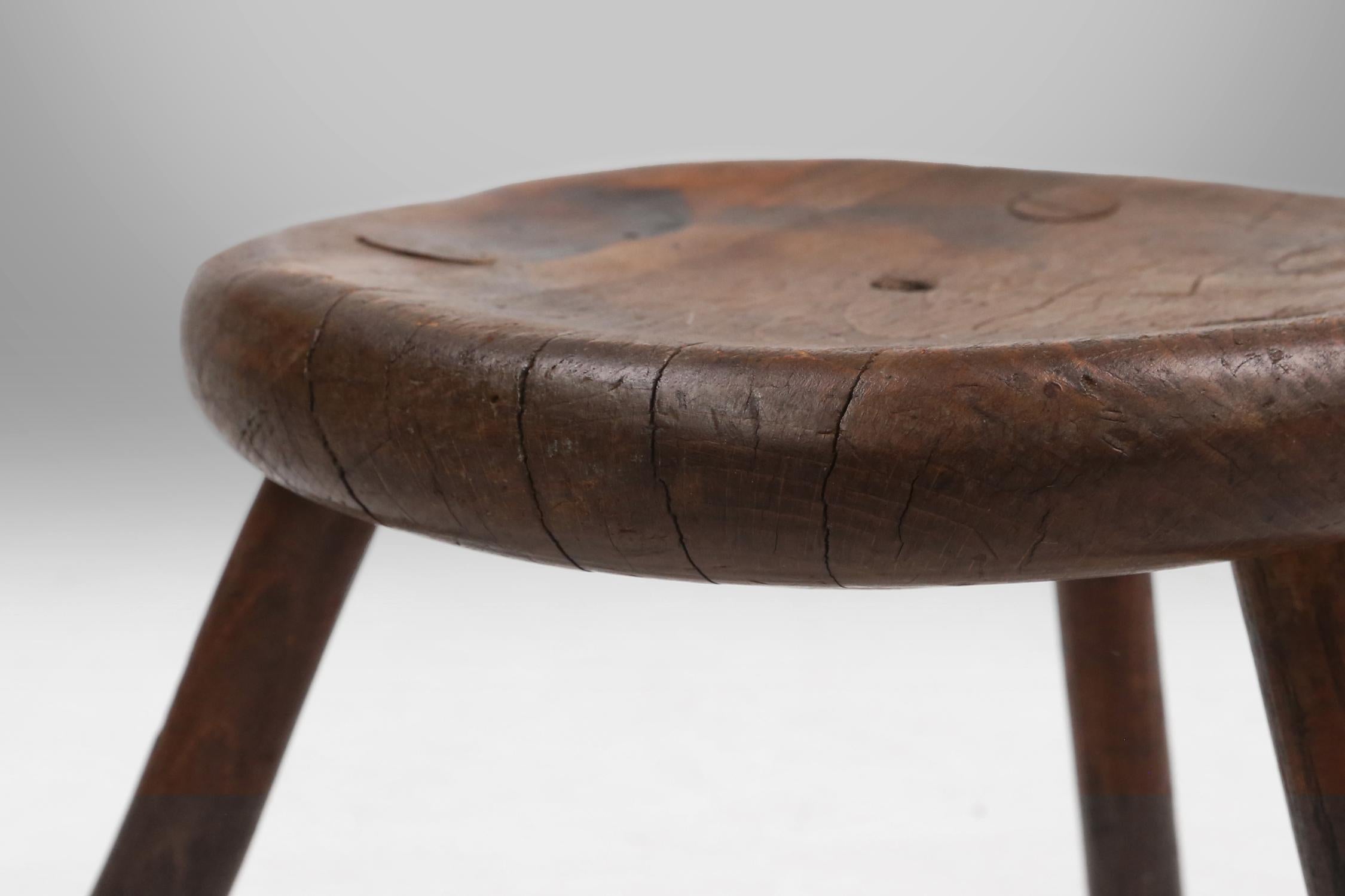 Wood Hand-carved solid wood tripod stool with beautiful patina, France ca. 1900 For Sale