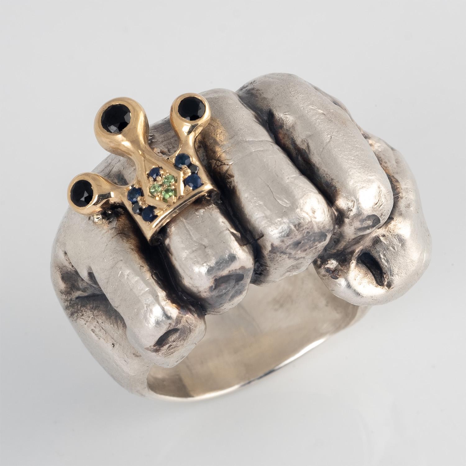 One of a Kind hand carved fist ring featuring a miniature 10 karat yellow gold crown ring. This sculptural ring makes a bold statement and is a wearable work of art.
If you like this ring, check out the companion piece in our collection. Listing