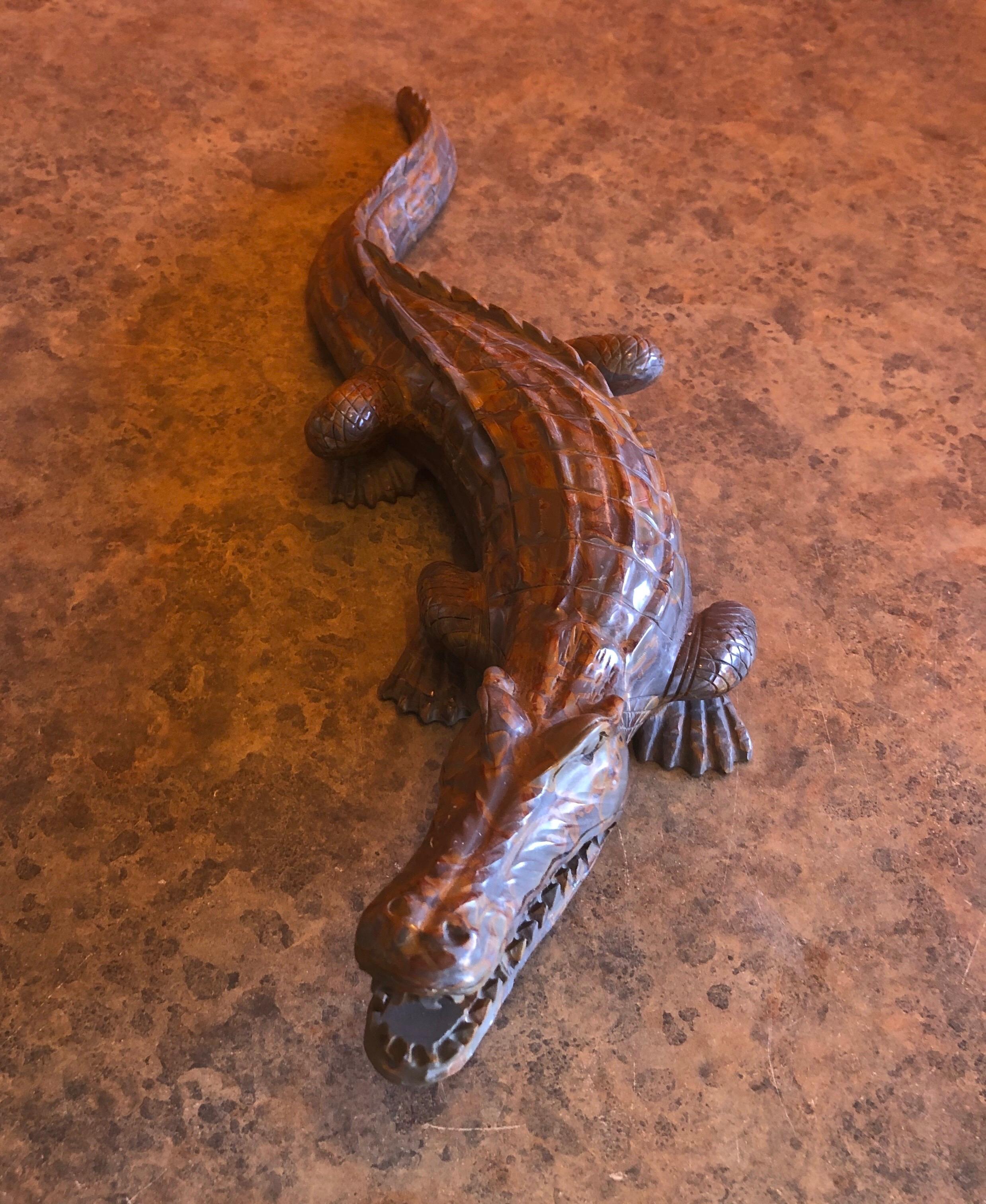 A very nice hand carved stone alligator / crocodile sculpture, circa 1980s. Great detail and color in this piece that measures 18